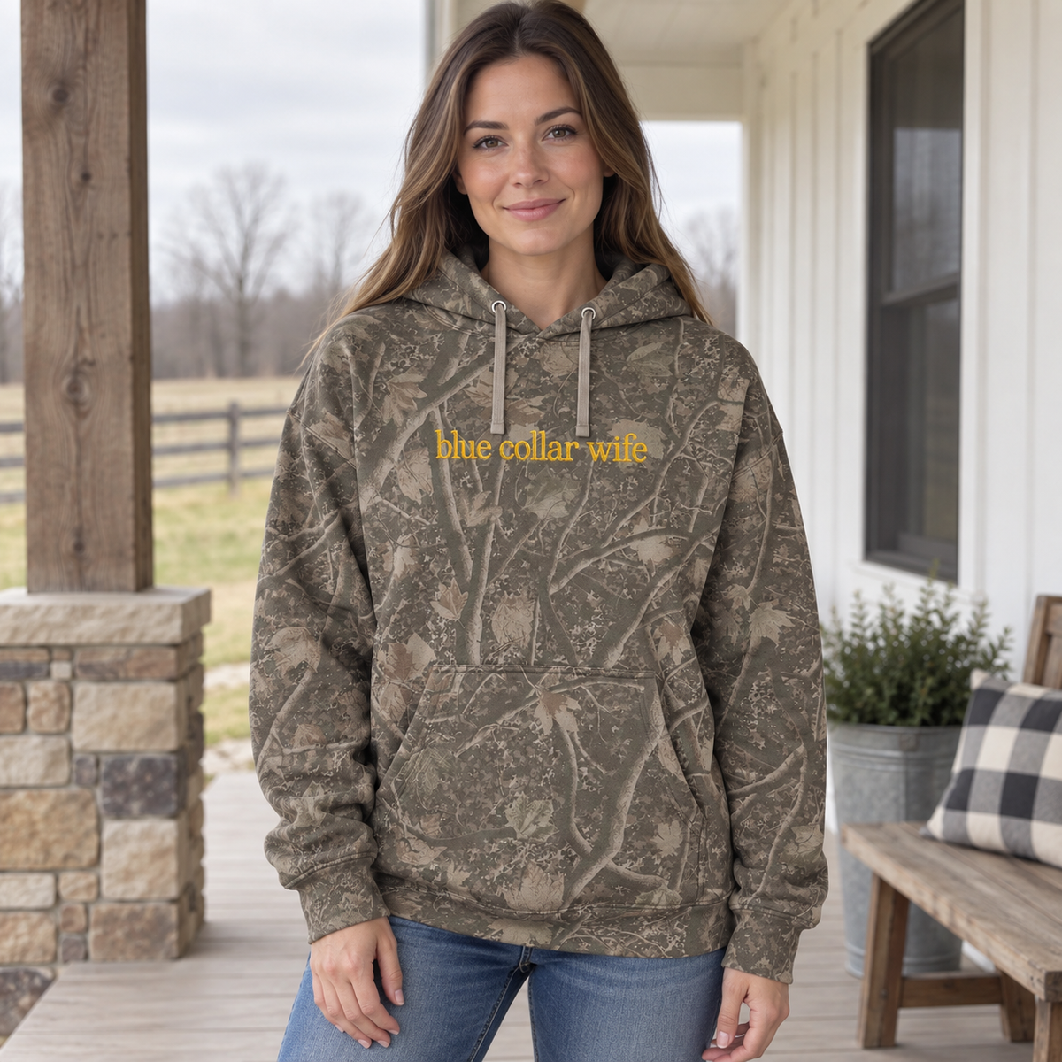 Model wearing the Blue Collar Wife heavyweight hoodie in Light Tree Camo, lifestyle image 1