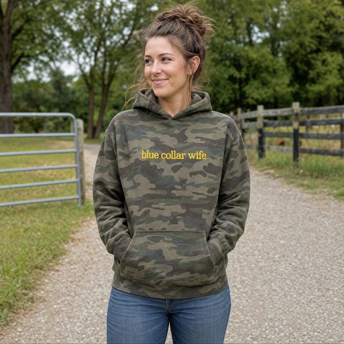 Model wearing the Blue Collar Wife heavyweight hoodie in Green Camo, lifestyle image 1