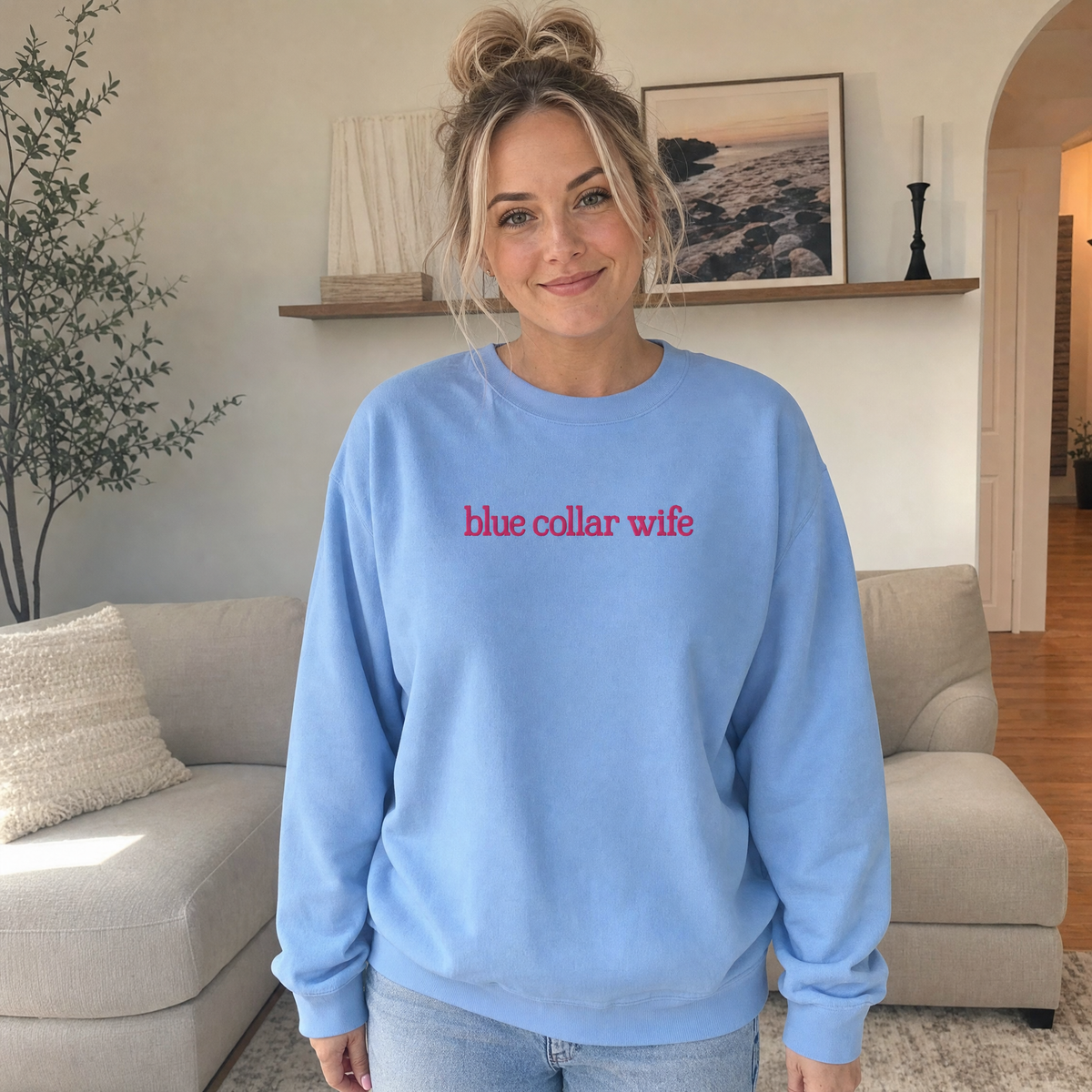 Model wearing the Blue Collar Wife sweatshirt in Carolina Blue, lifestyle image 1