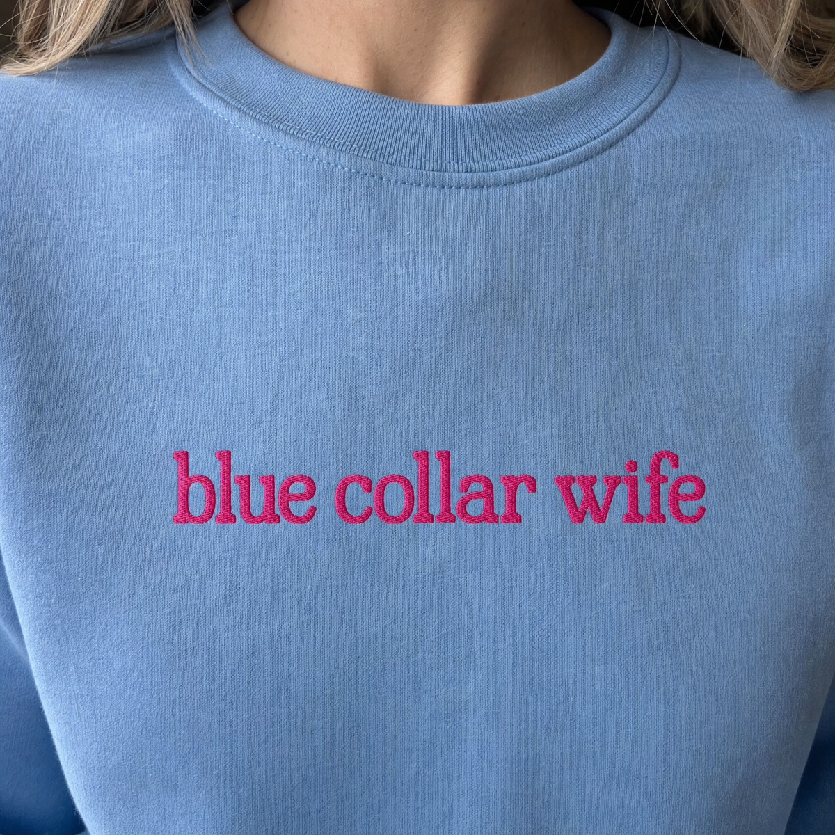 Model wearing the Blue Collar Wife sweatshirt in Carolina Blue, lifestyle image 2