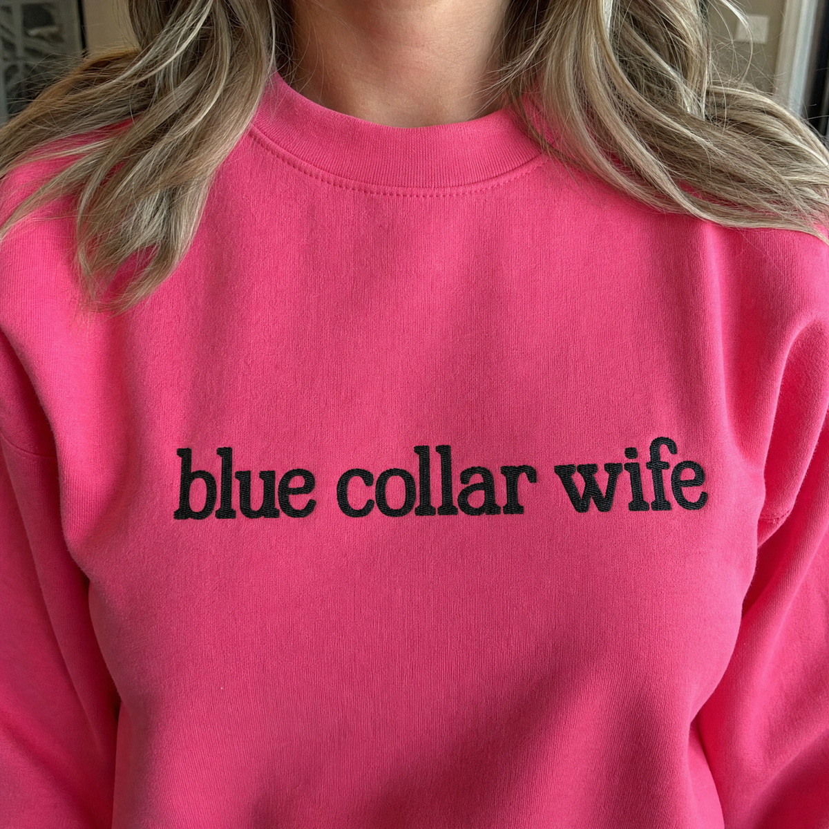 Model wearing the Blue Collar Wife sweatshirt in Heliconia, lifestyle image 2