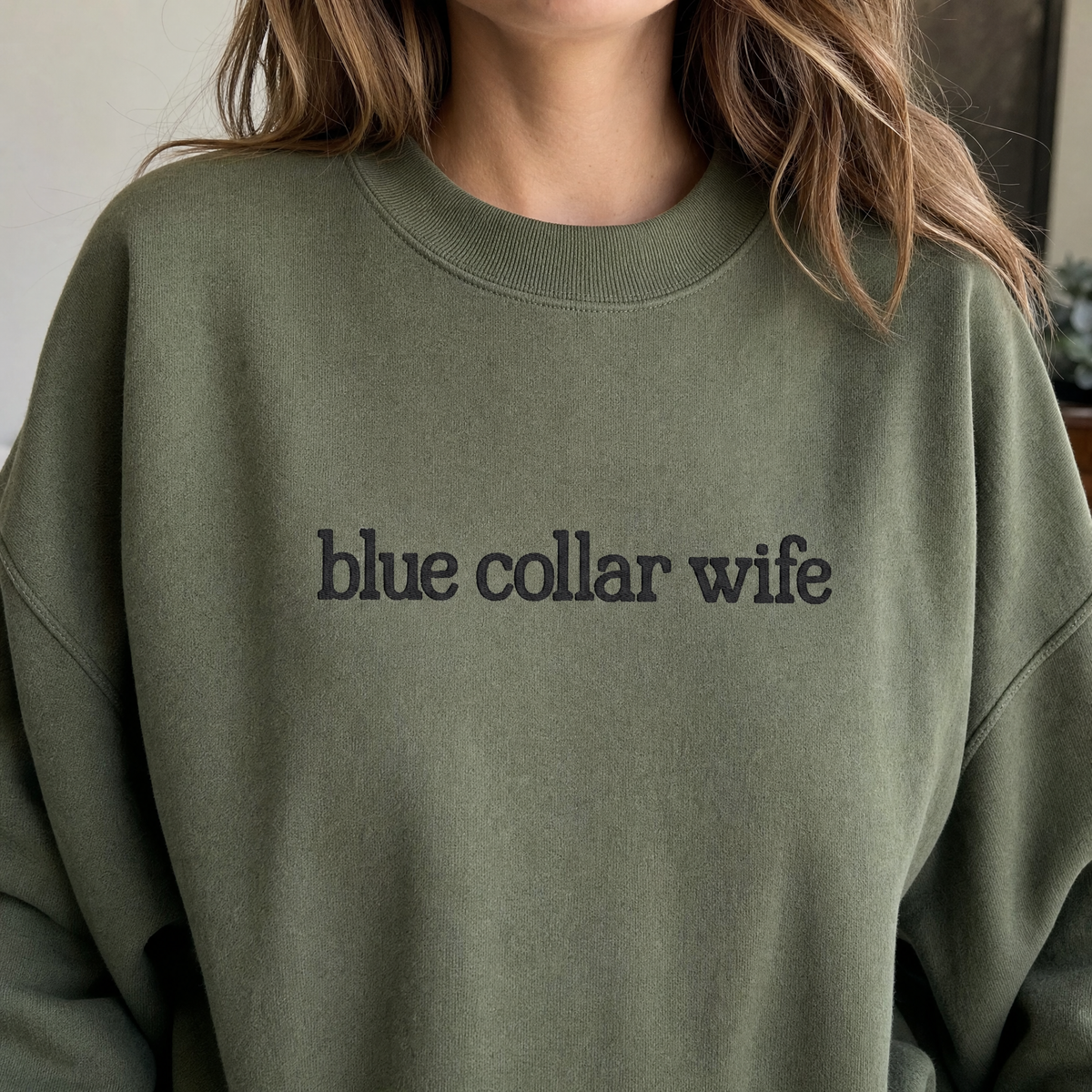 Model wearing the Blue Collar Wife sweatshirt in Military Green, lifestyle image 2