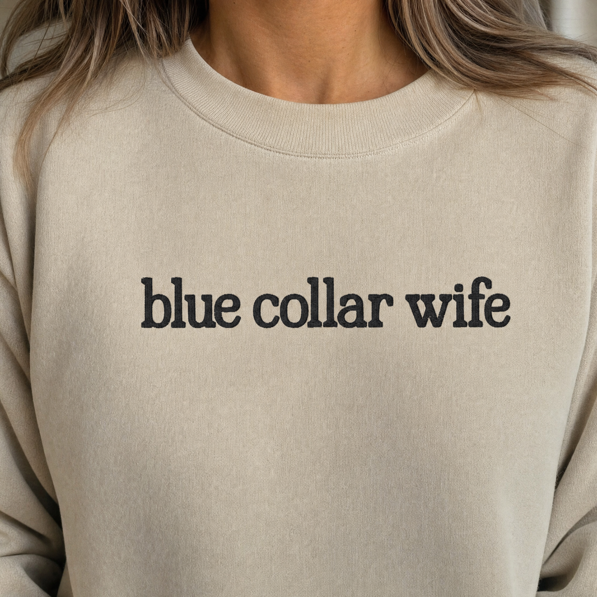 Model wearing the Blue Collar Wife sweatshirt in Sand, lifestyle image 2