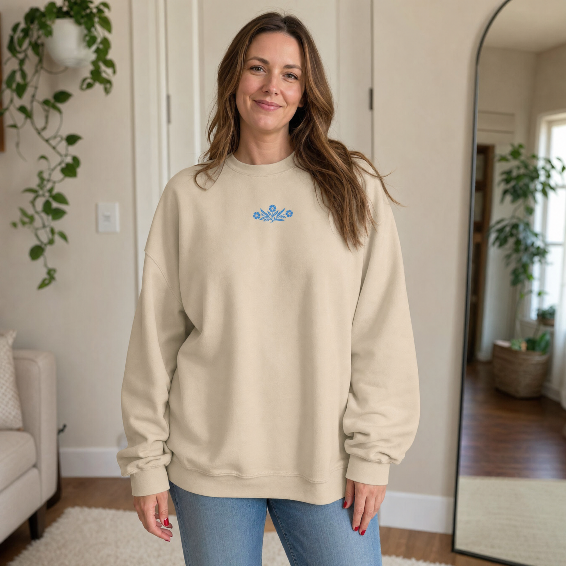 Model wearing the Cornflower Blue Flowers sweatshirt in Sand, lifestyle image 1