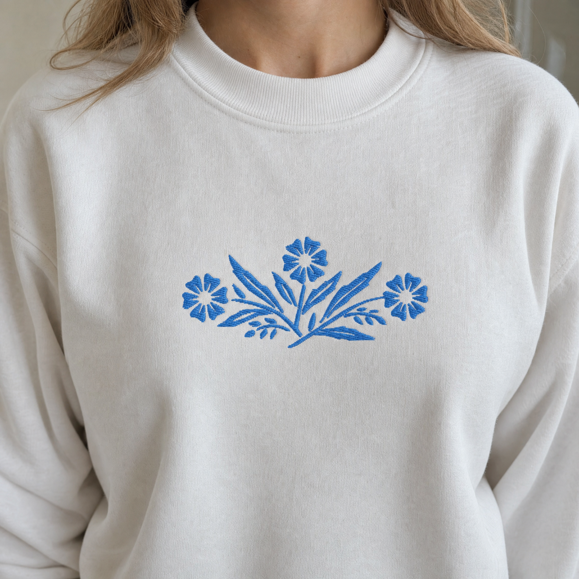 Model wearing the Cornflower Blue Flowers sweatshirt in White, lifestyle image 2