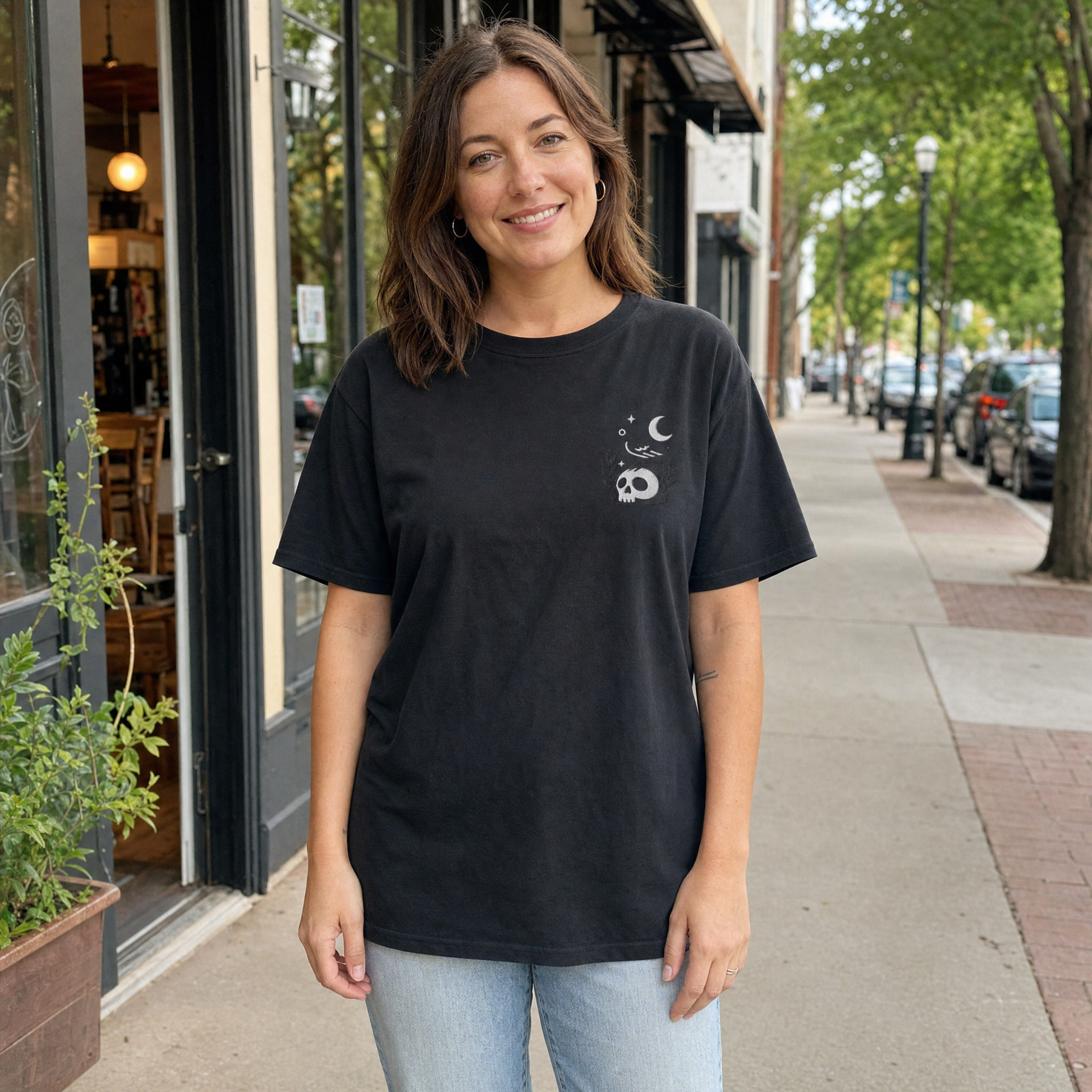 Model wearing the Crow on Skull comfort colors tee in Black, lifestyle image 1