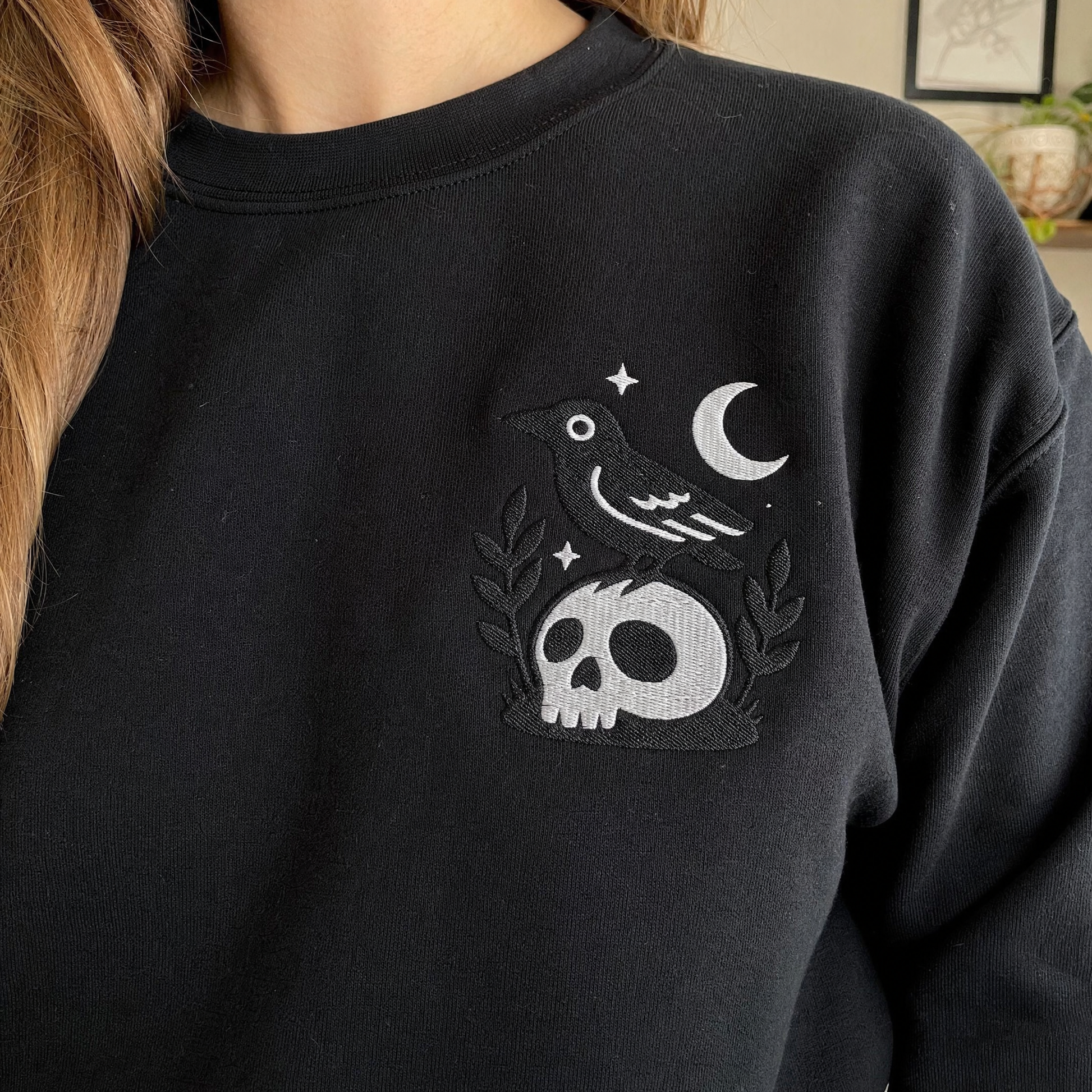 Model wearing the Crow on Skull sweatshirt in Black, lifestyle image 2