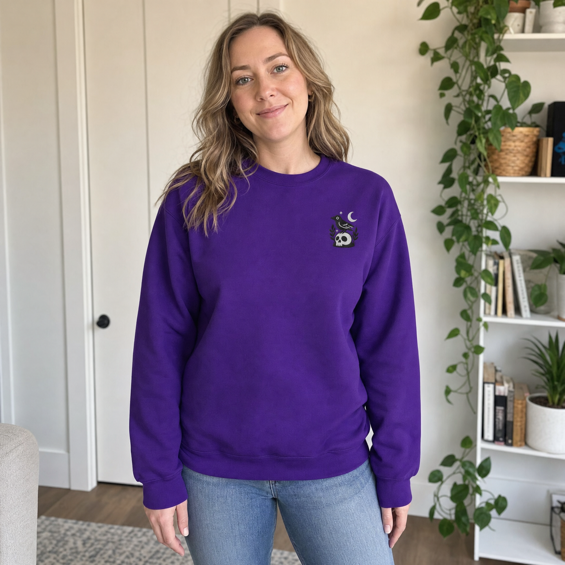 Model wearing the Crow on Skull sweatshirt in Purple, lifestyle image 1