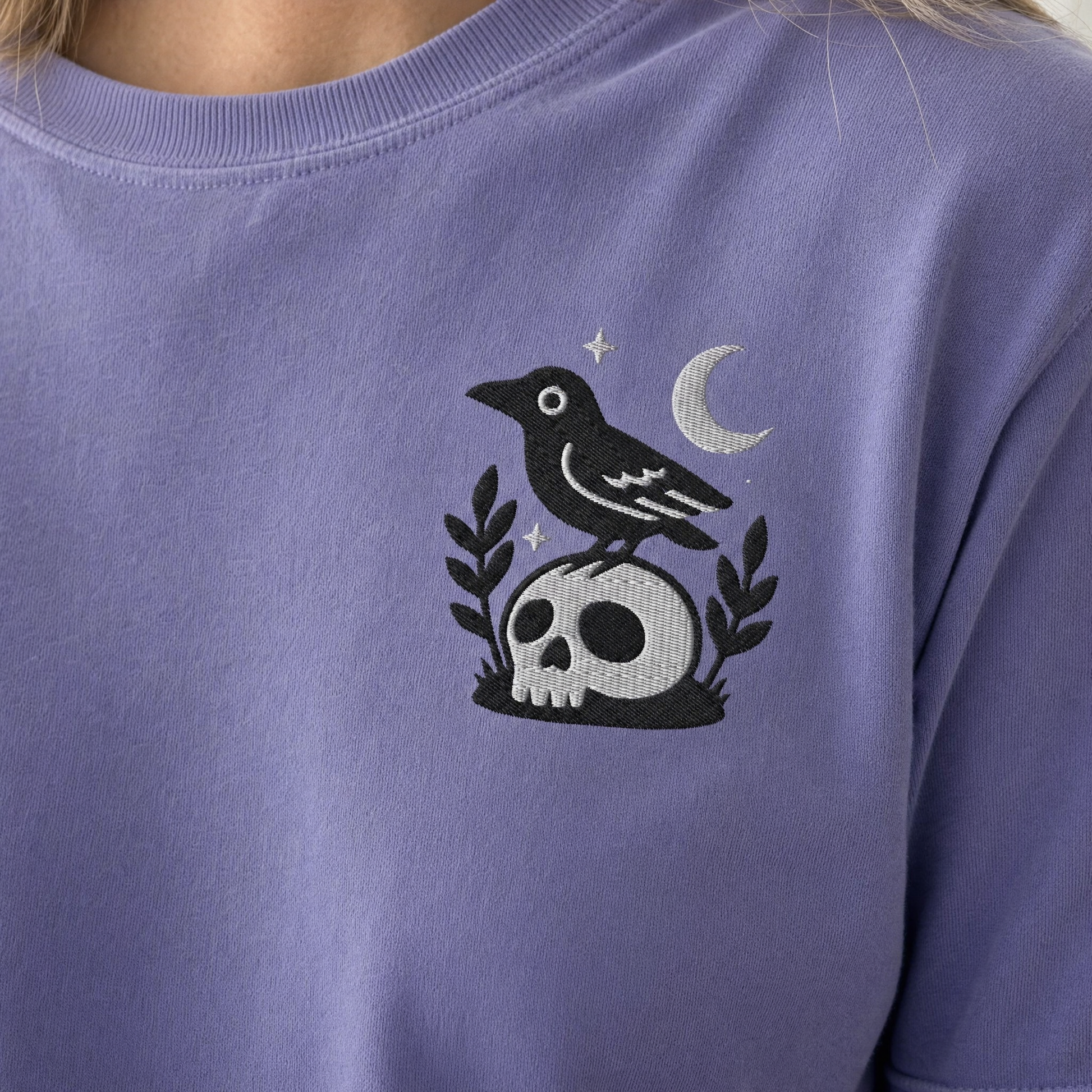 Model wearing the Crow on Skull comfort colors tee in Violet, lifestyle image 2