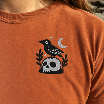 Model wearing the Crow on Skull comfort colors tee in Yam, lifestyle image 2