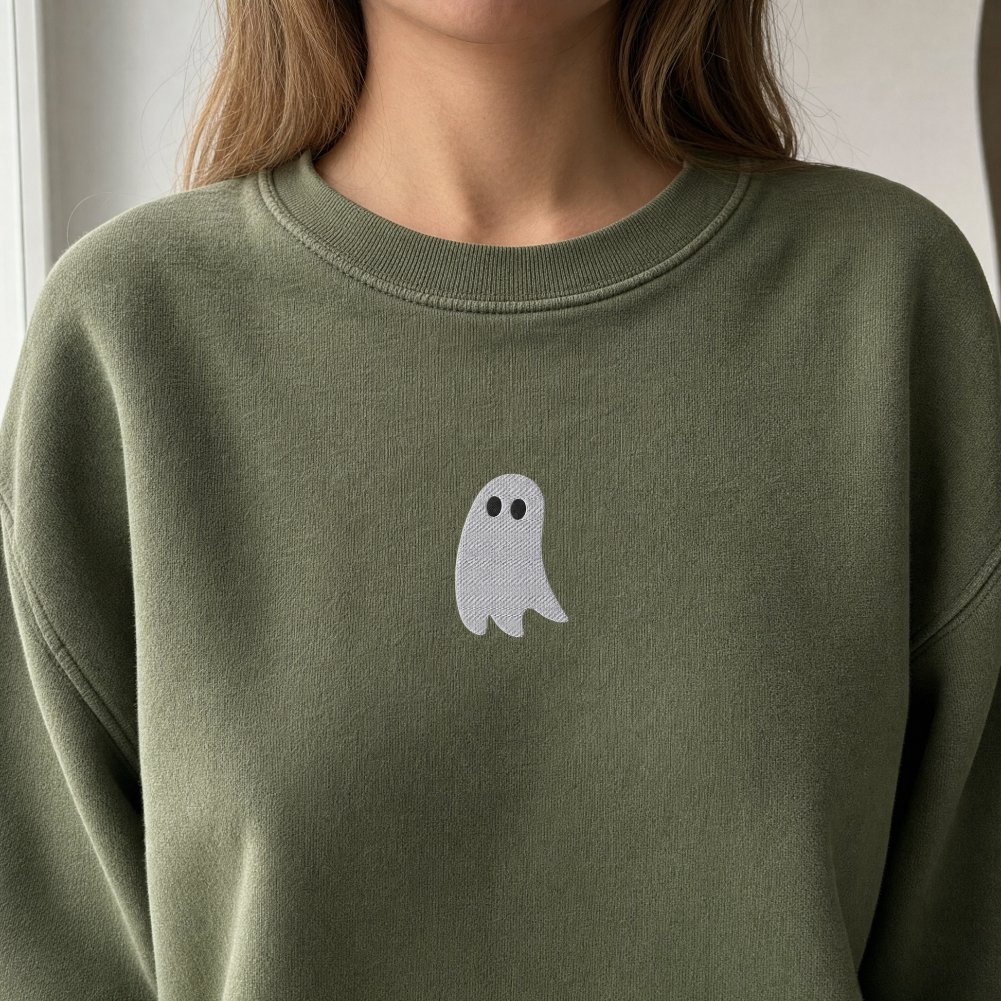 Model wearing the Cute Ghost sweatshirt in Military Green, lifestyle image 2
