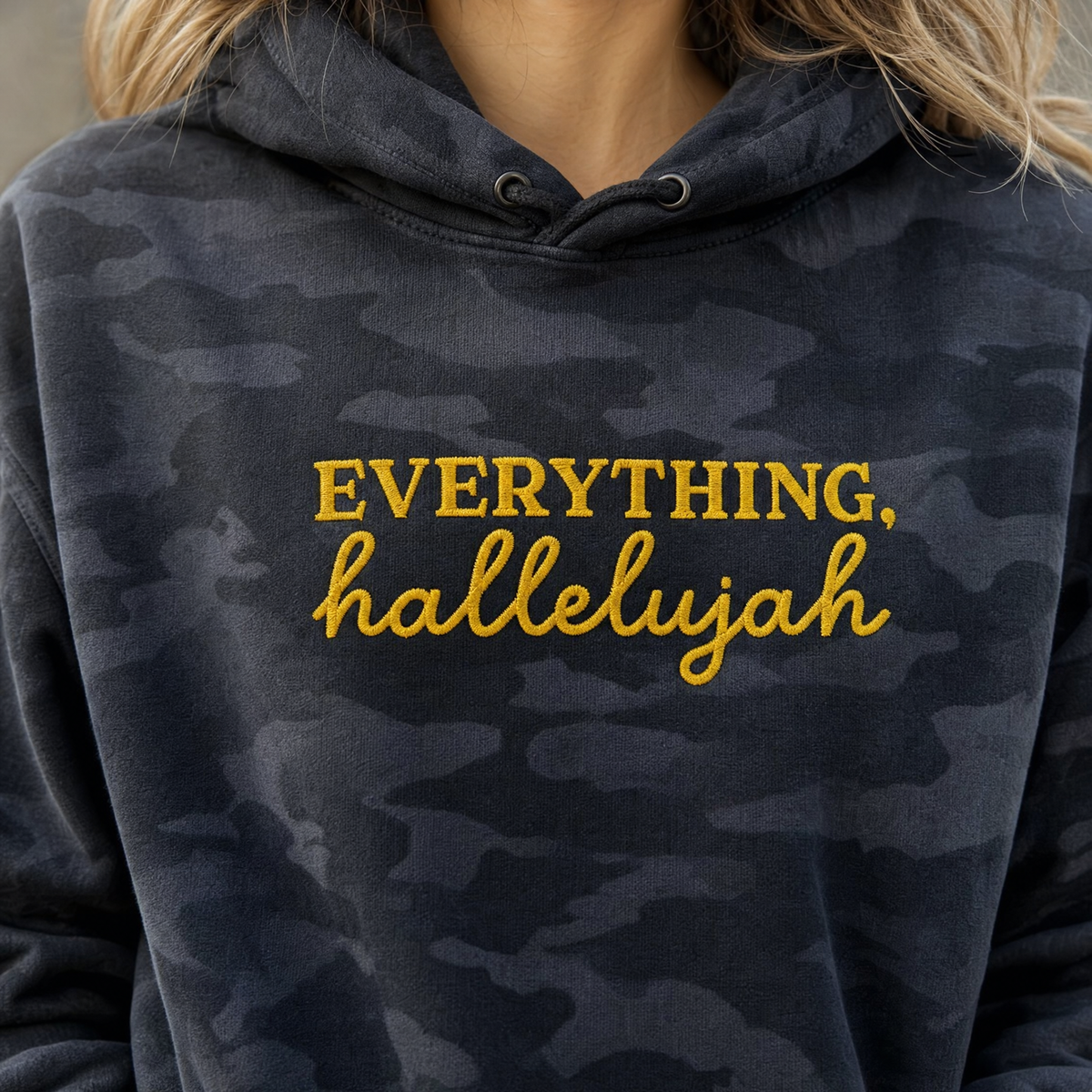 Model wearing the Everything Hallelujah heavyweight hoodie in Black Camo, lifestyle image 2