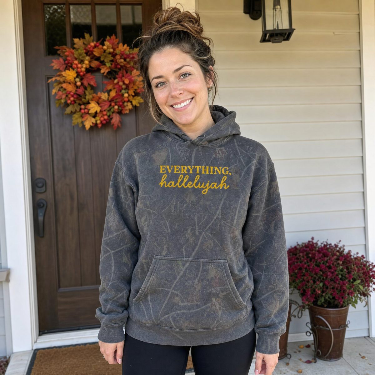 Model wearing the Everything Hallelujah heavyweight hoodie in Dark Tree Camo, cover image 1