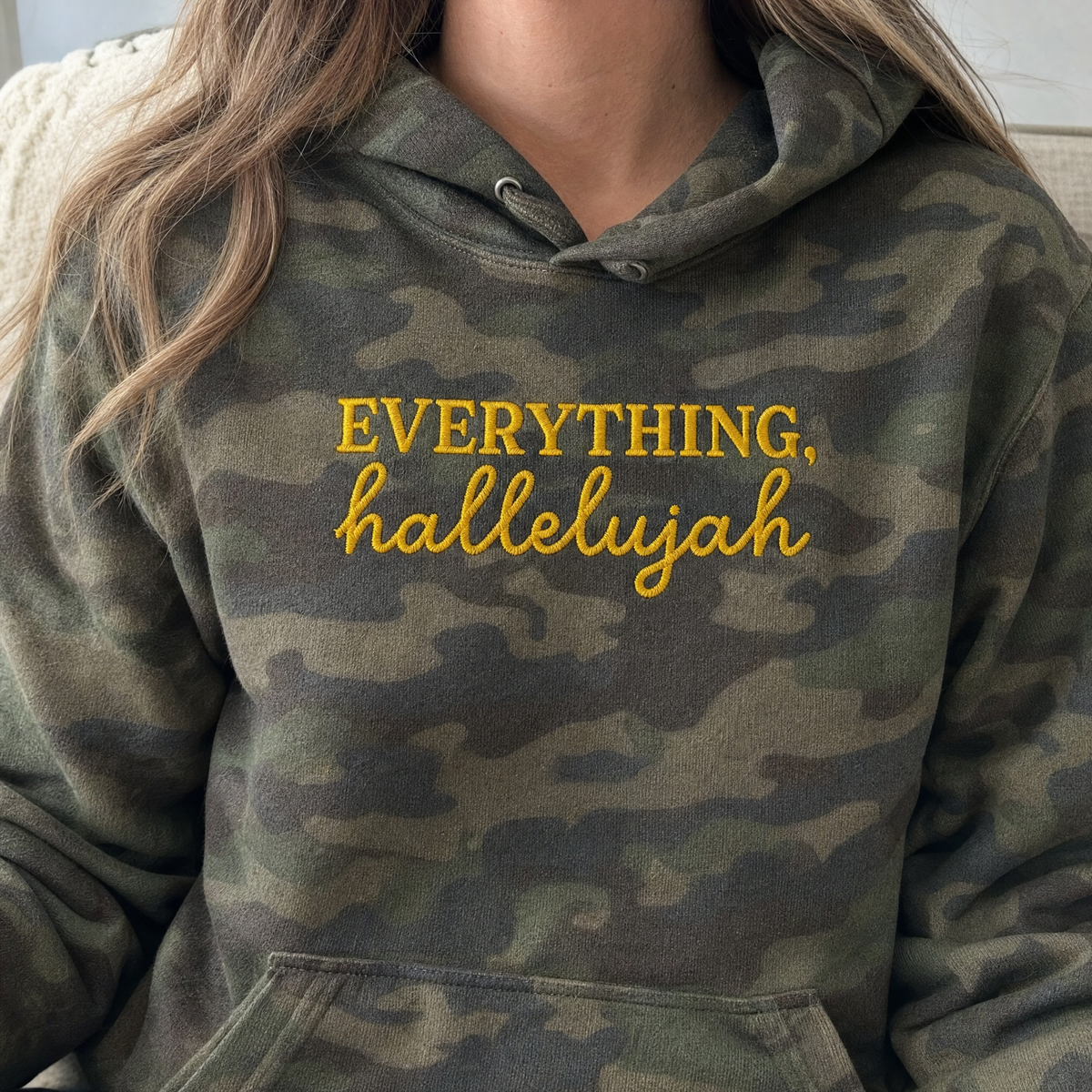 Model wearing the Everything Hallelujah heavyweight hoodie in Green Camo, lifestyle image 2