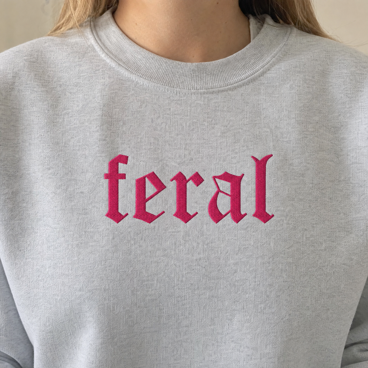 Model wearing the Feral sweatshirt in Ash, lifestyle image 2