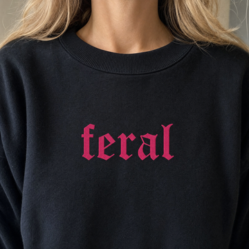Model wearing the Feral sweatshirt in Black, lifestyle image 1