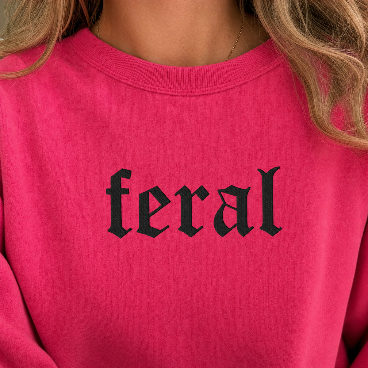 Model wearing the Feral sweatshirt in Heliconia, lifestyle image 2