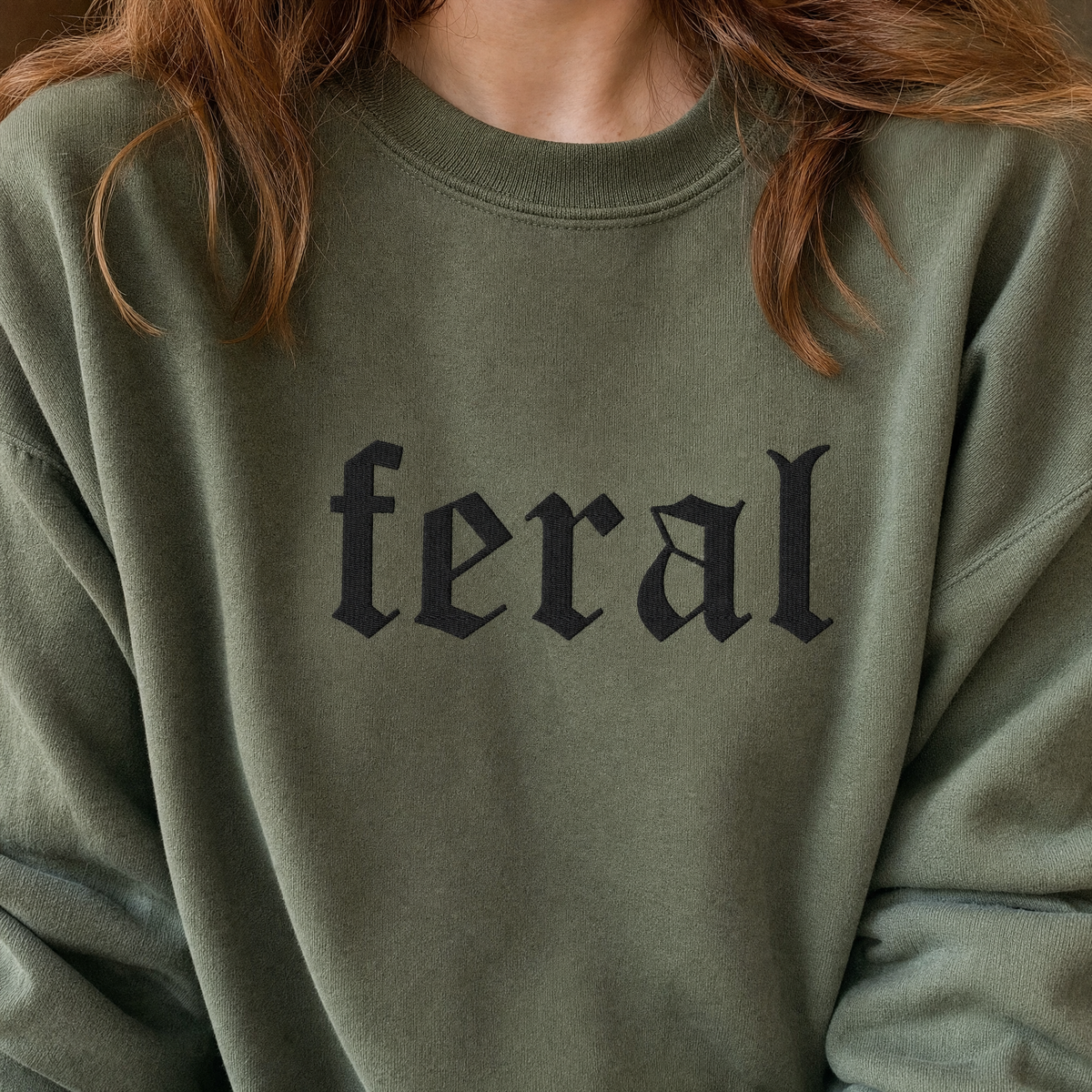 Model wearing the Feral sweatshirt in Military Green, lifestyle image 2