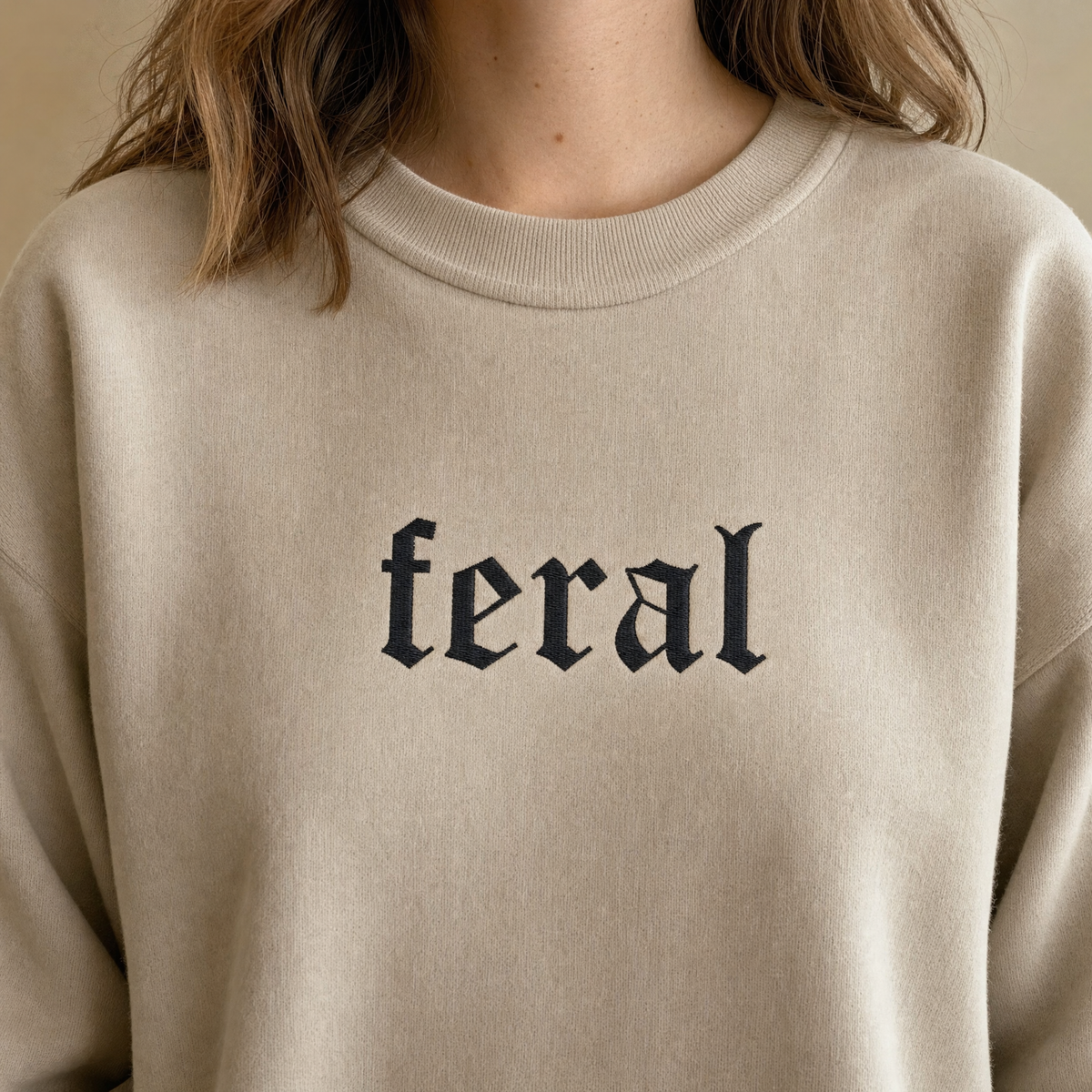 Model wearing the Feral sweatshirt in Sand, lifestyle image 2