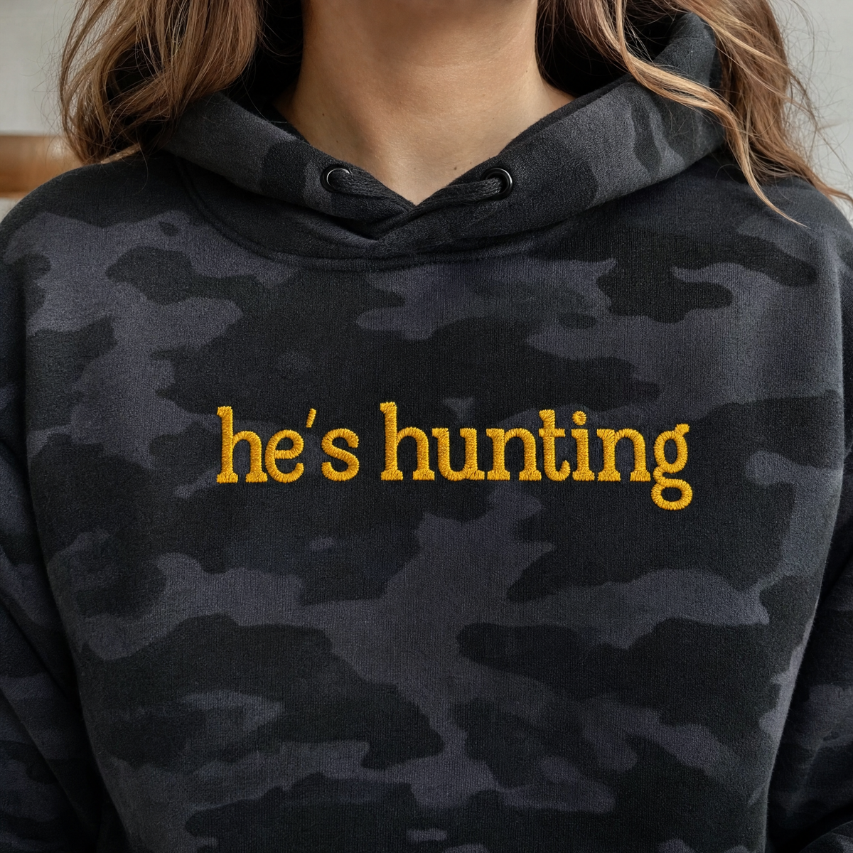 Model wearing the He's Hunting heavyweight hoodie in Black Camo, lifestyle image 2
