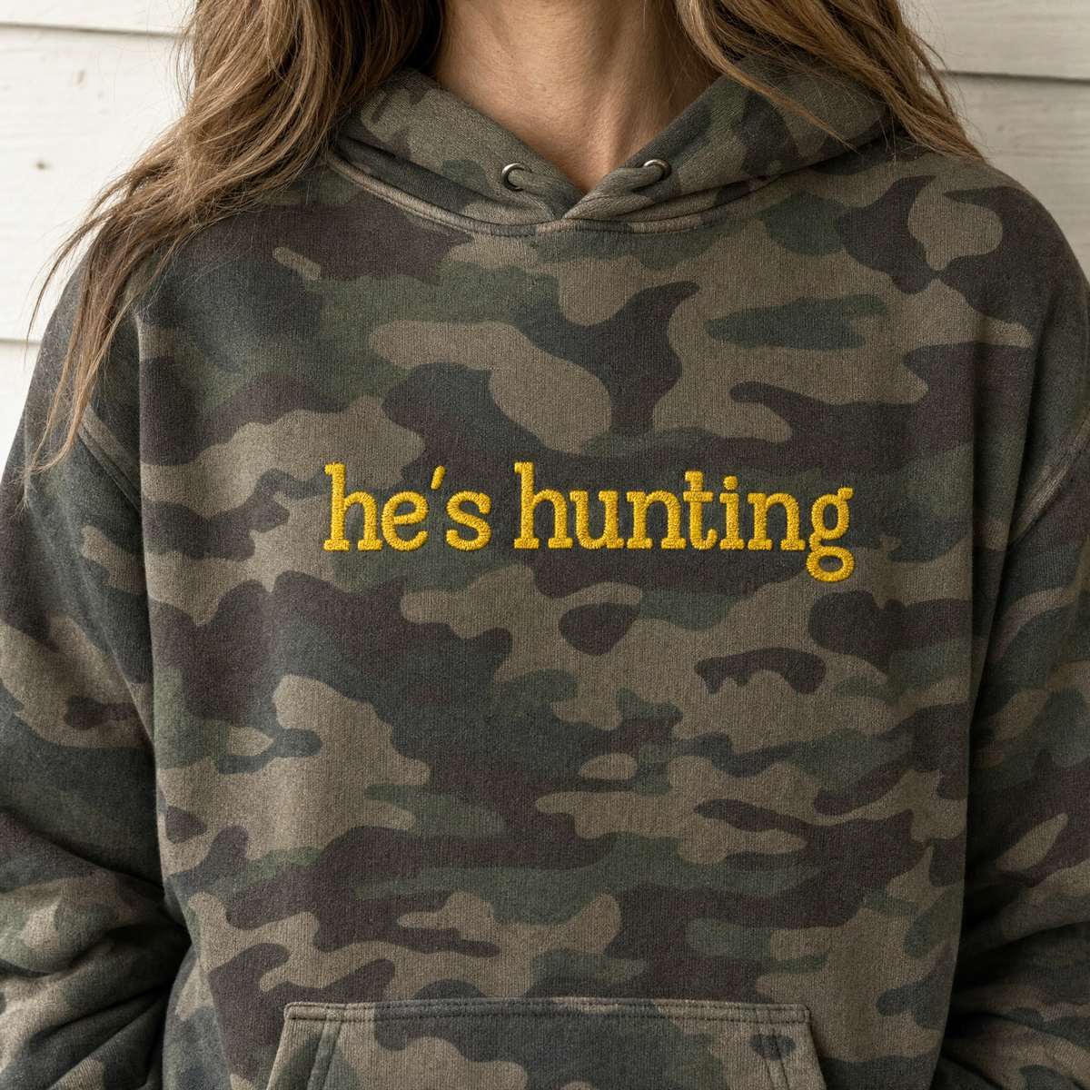 Model wearing the He's Hunting heavyweight hoodie in Forest Camo, lifestyle image 2