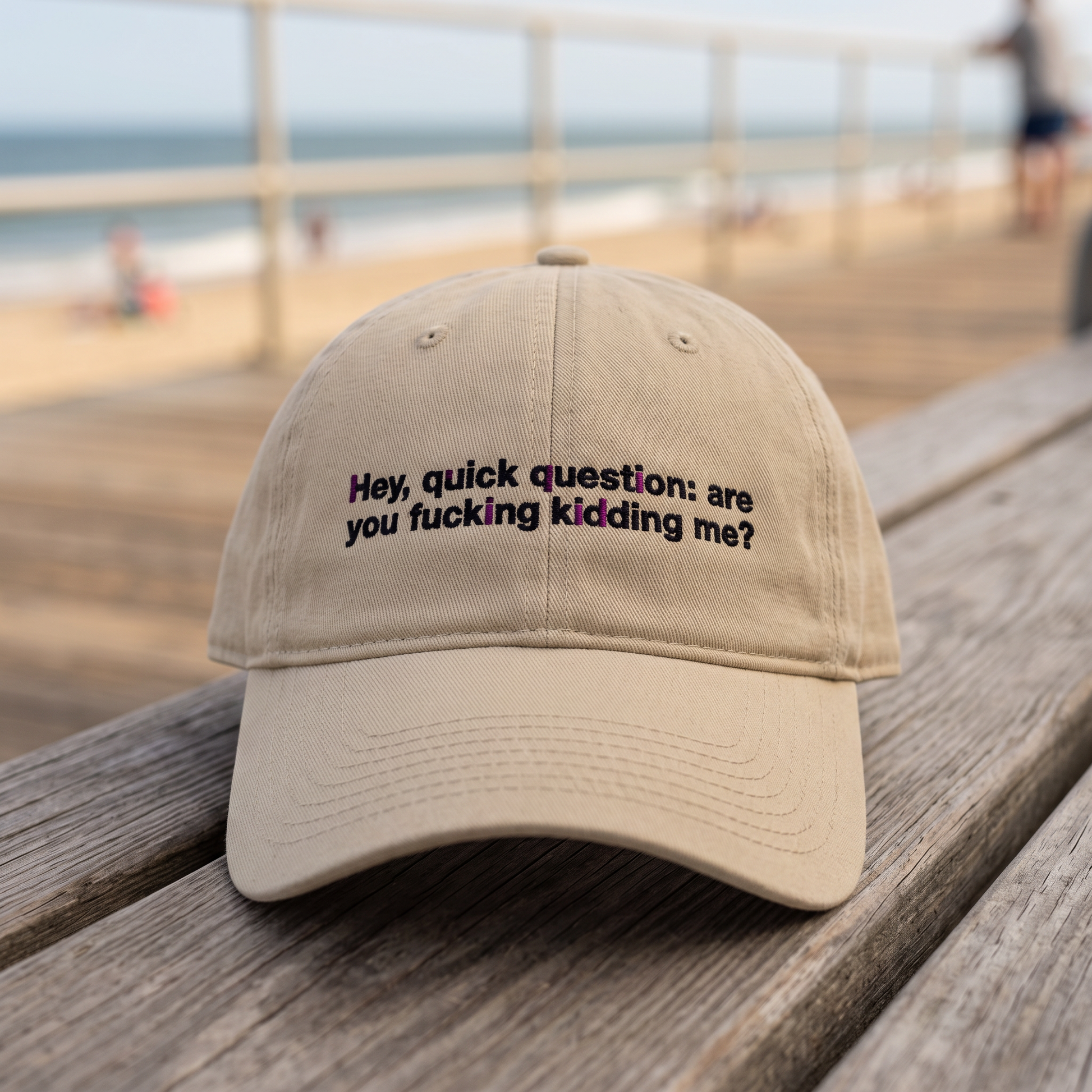 Hey Quick Question embroidered hat in Khaki resting on a flat surface, lifestyle image 2