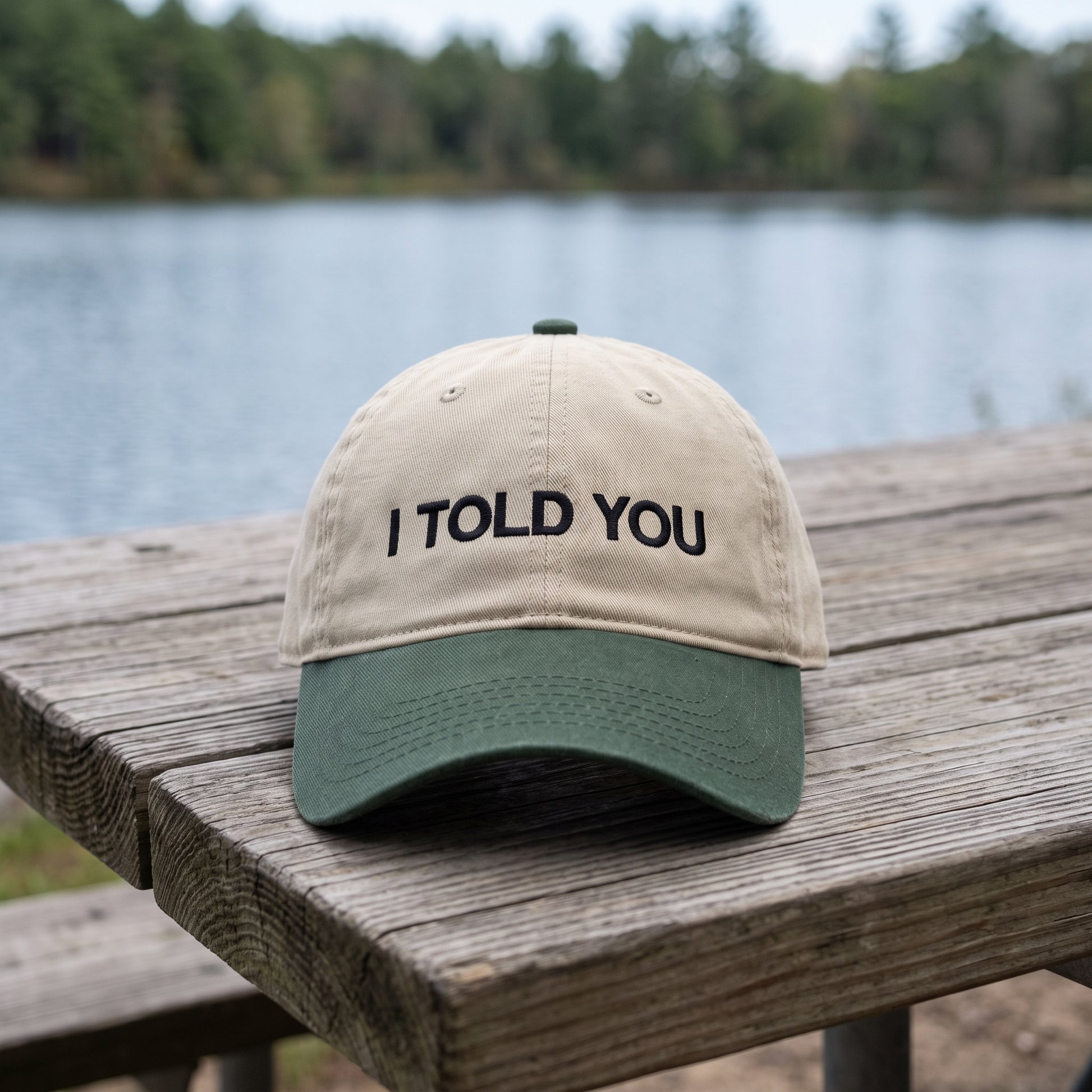 I Told You embroidered hat in Dark Green/khaki resting on a flat surface, lifestyle image 1