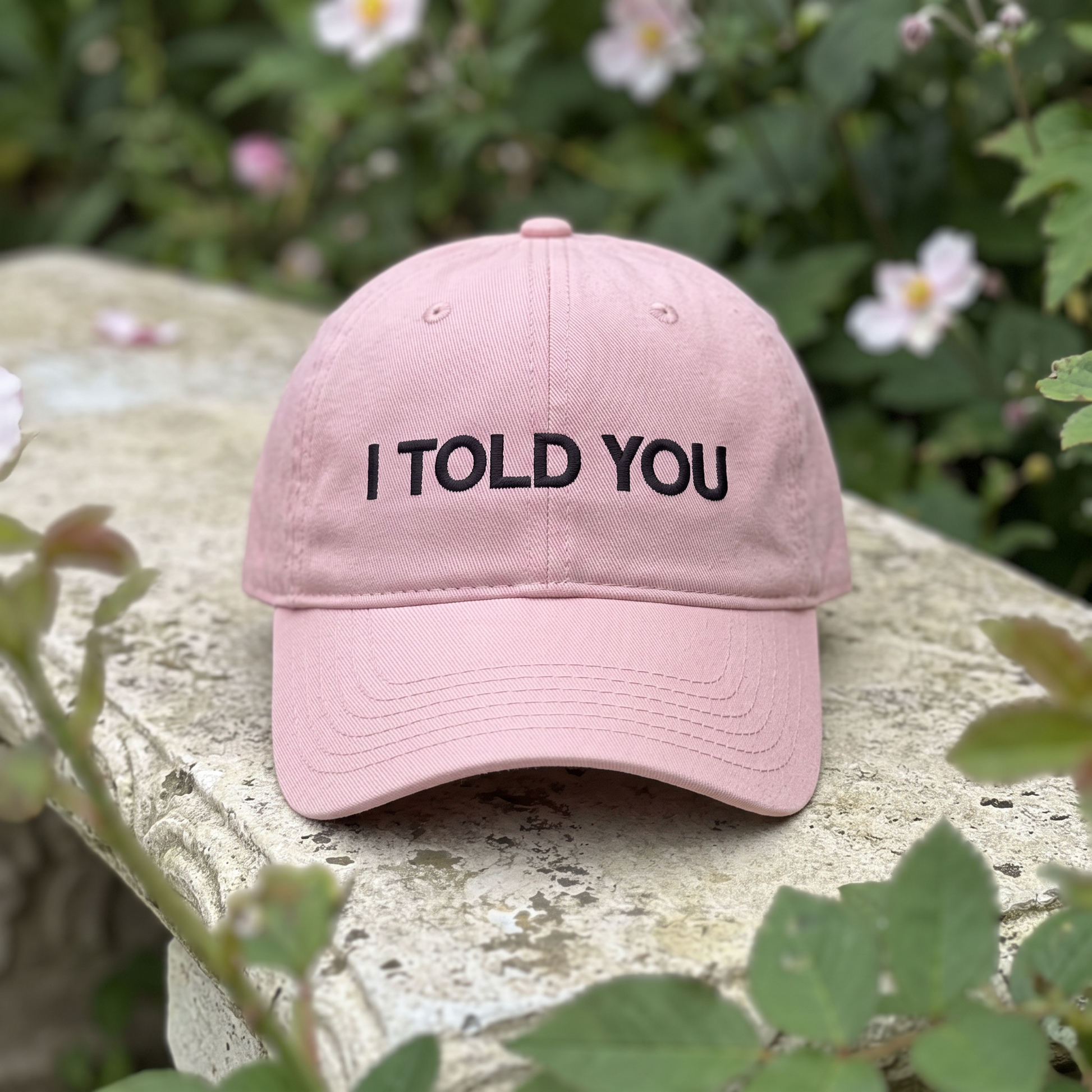 I Told You embroidered hat in Dusty Rose resting on a flat surface, lifestyle image 2