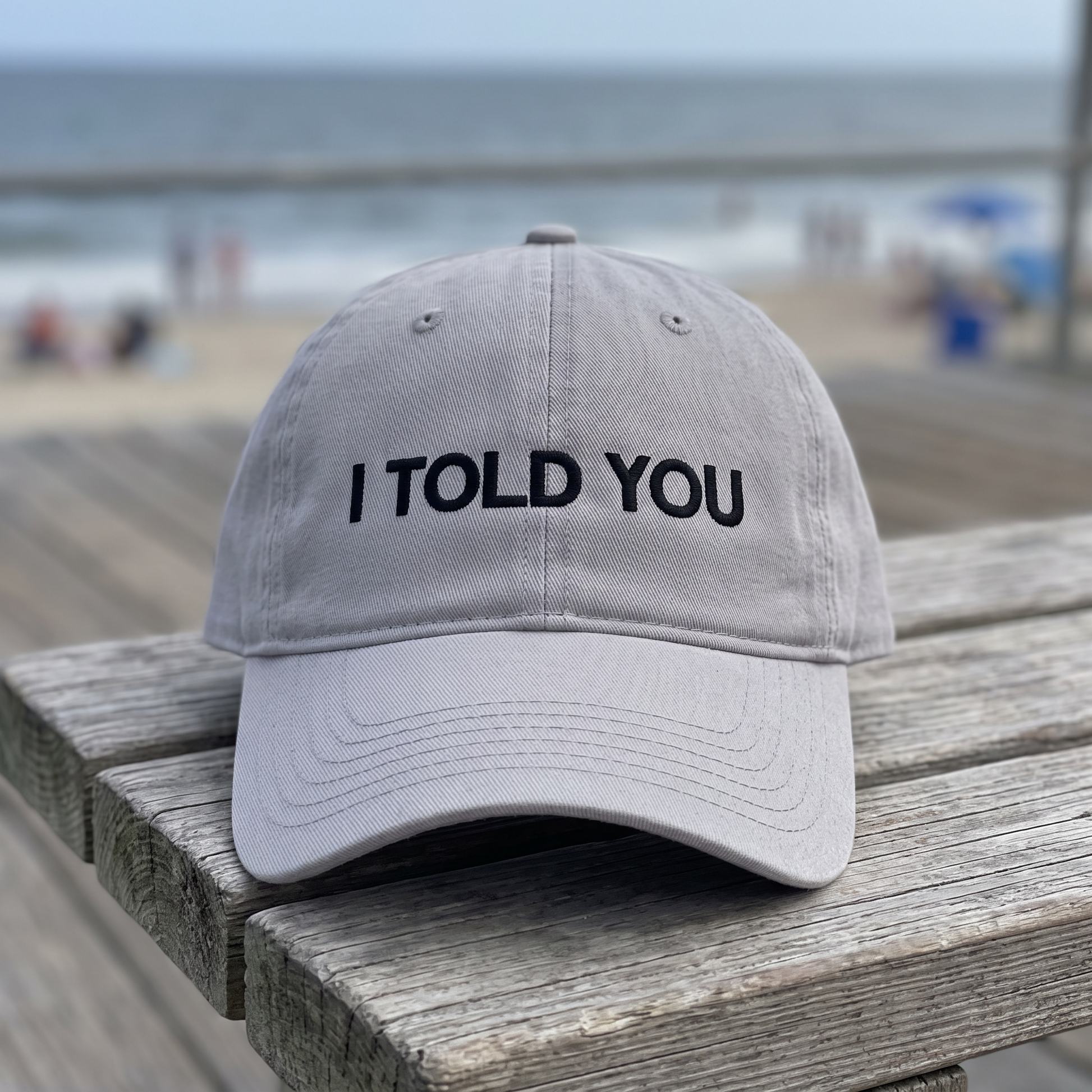 I Told You embroidered hat in Gray resting on a flat surface, lifestyle image 2