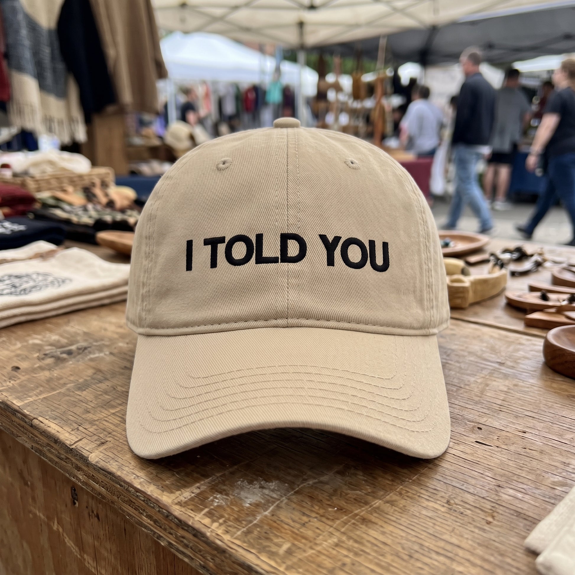 I Told You embroidered hat in Khaki resting on a flat surface, lifestyle image 1
