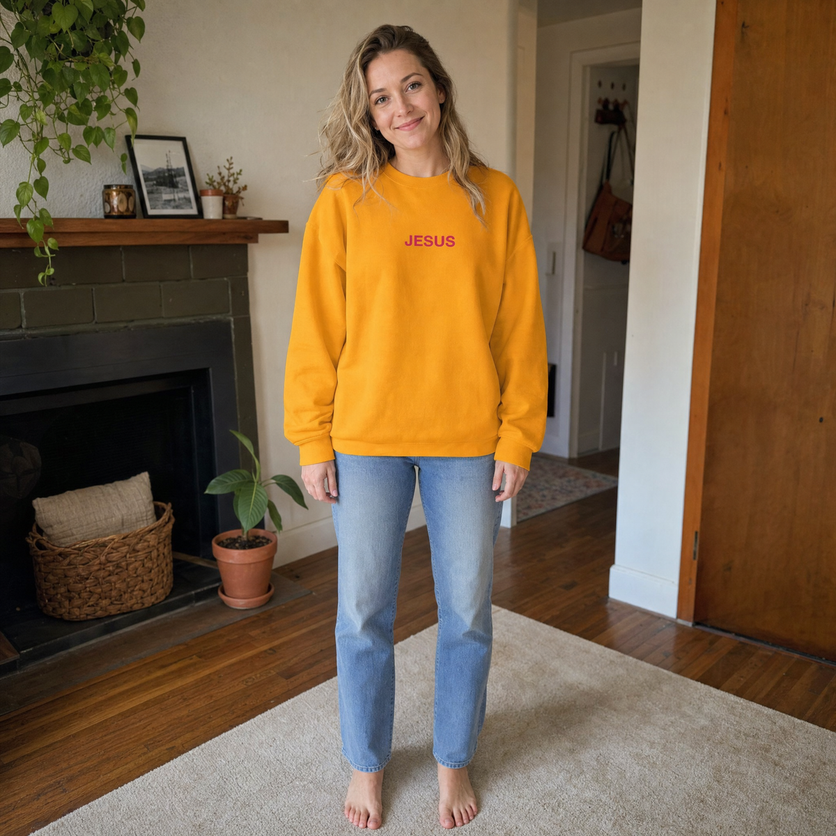 Model wearing the JESUS Pink Lettering Sweatshirt sweatshirt in Gold, lifestyle image 1