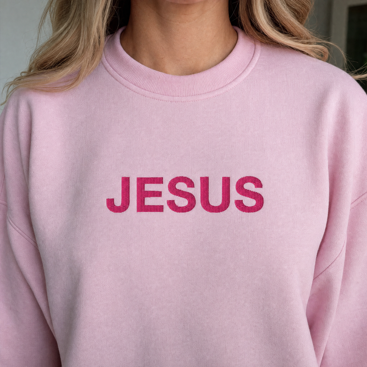 Model wearing the JESUS Pink Lettering Sweatshirt sweatshirt in Light Pink, lifestyle image 2
