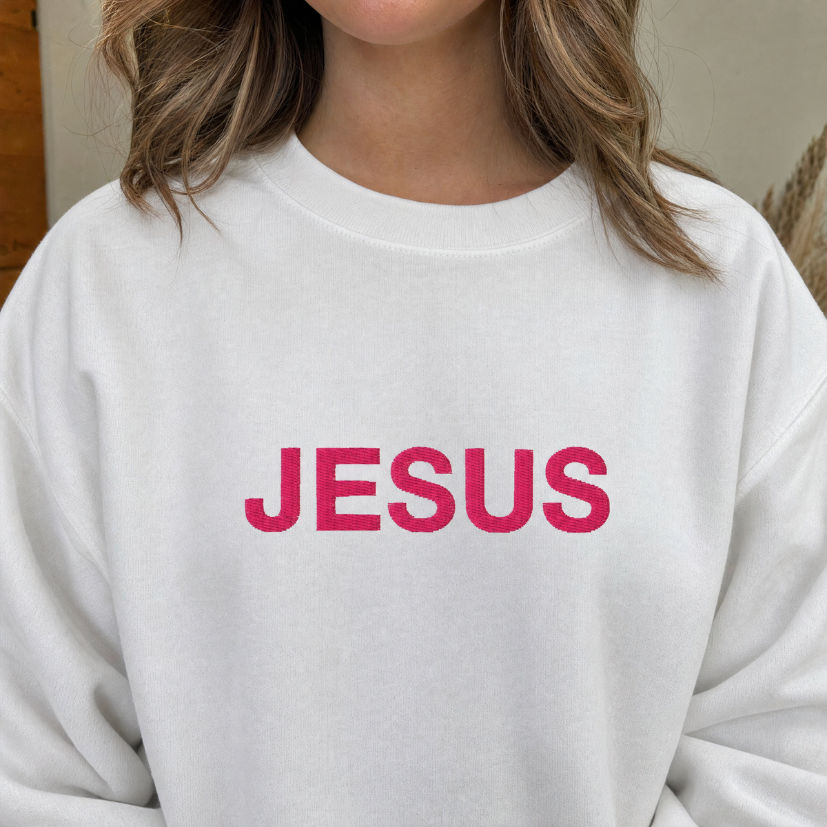 Model wearing the JESUS Pink Lettering Sweatshirt sweatshirt in White, lifestyle image 2