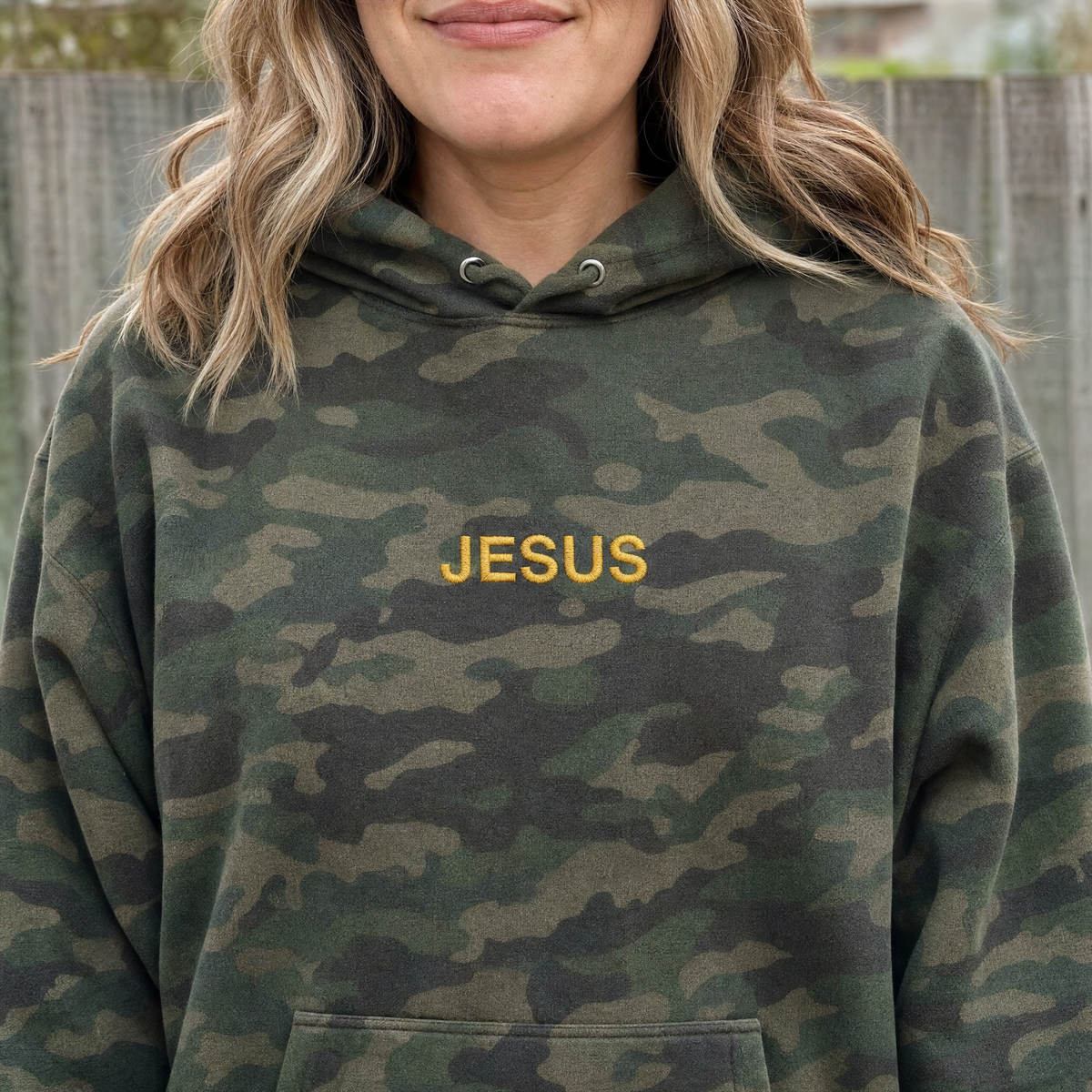 Model wearing the JESUS Text heavyweight hoodie in Green Camo, lifestyle image 2