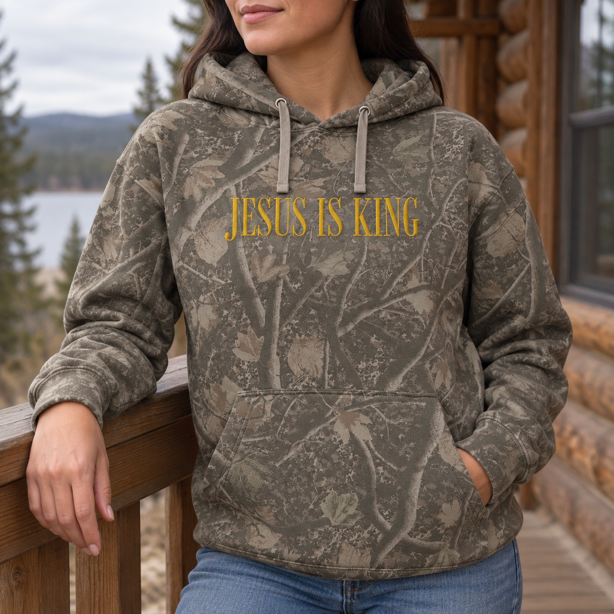 Model wearing the Jesus Is King heavyweight hoodie in Light Tree Camo, lifestyle image 2