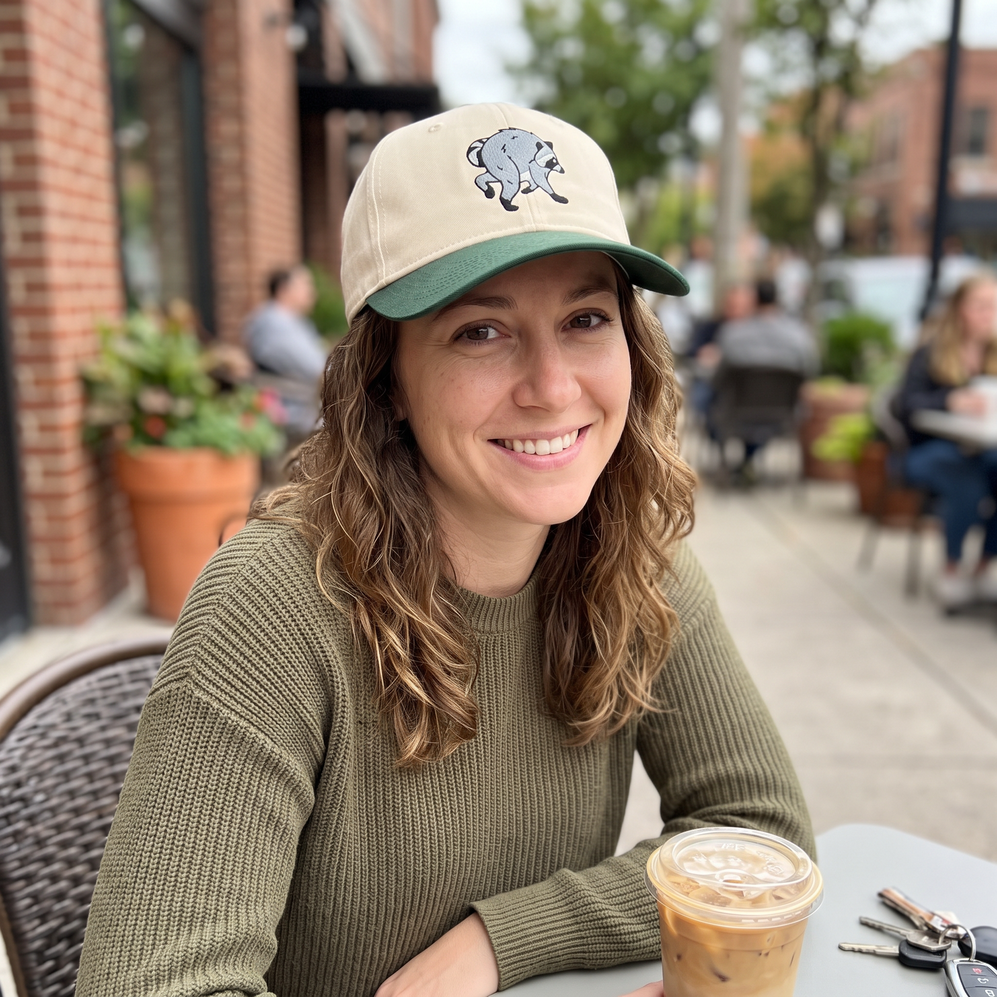 Jimothy Raccoon embroidered hat in Dark Green/natural worn lifestyle photo