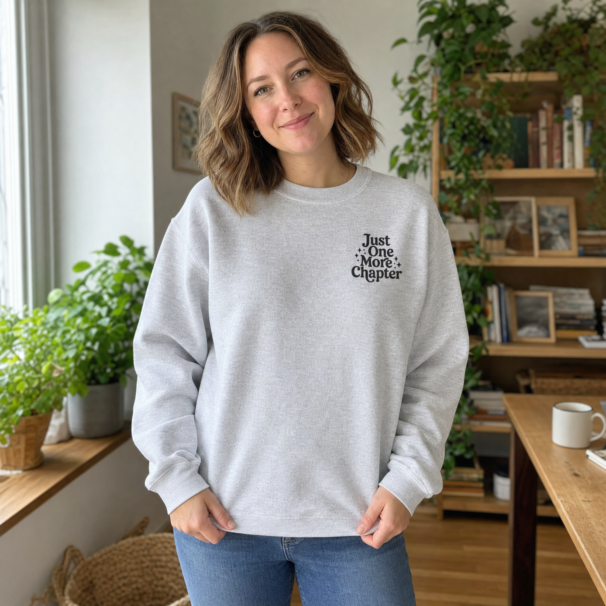 Model wearing the Just One More Chapter sweatshirt in Ash, lifestyle image 1