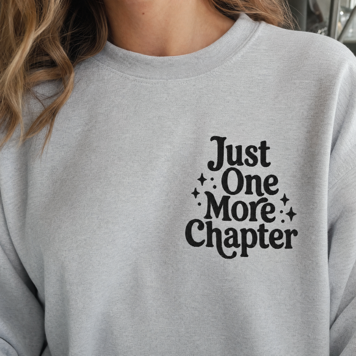 Model wearing the Just One More Chapter sweatshirt in Ash, lifestyle image 2