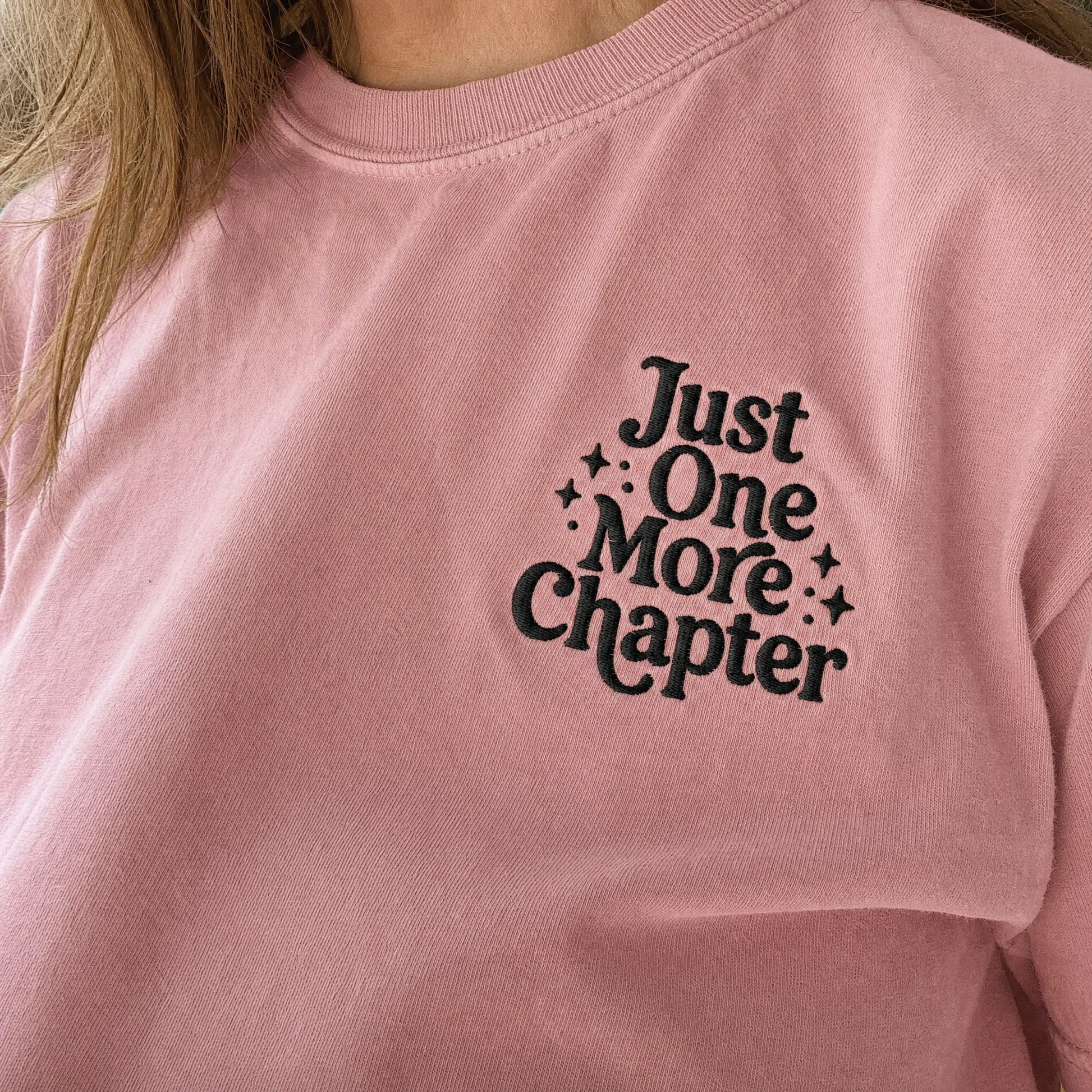 Model wearing the Just One More Chapter comfort colors tee in Blossom, lifestyle image 2