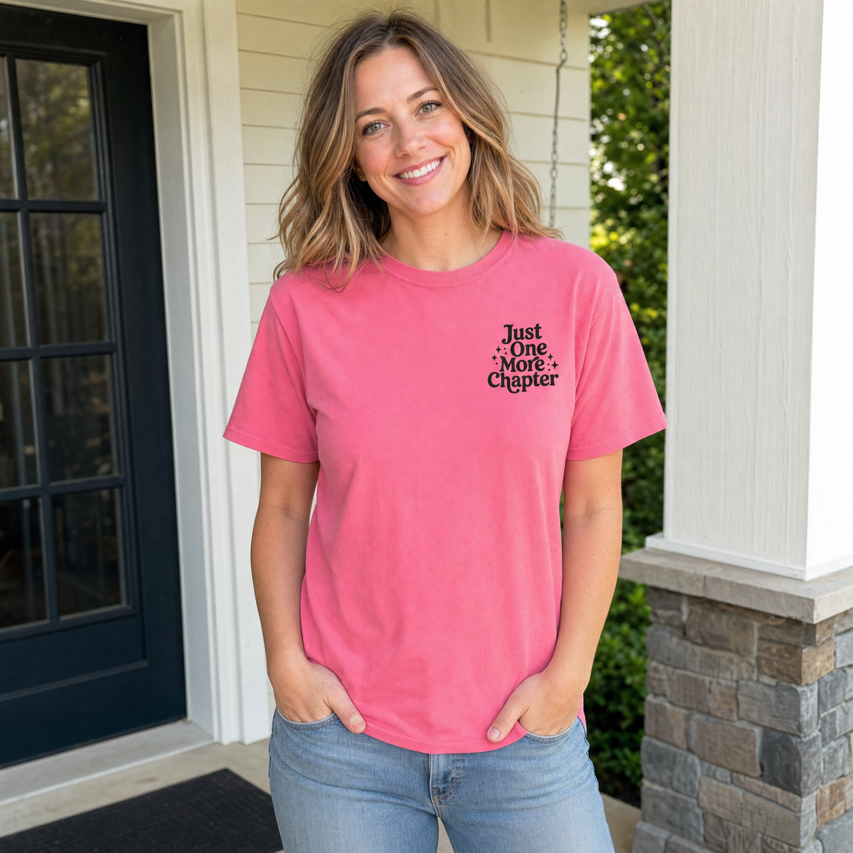 Model wearing the Just One More Chapter comfort colors tee in Crunchberry, lifestyle image 1
