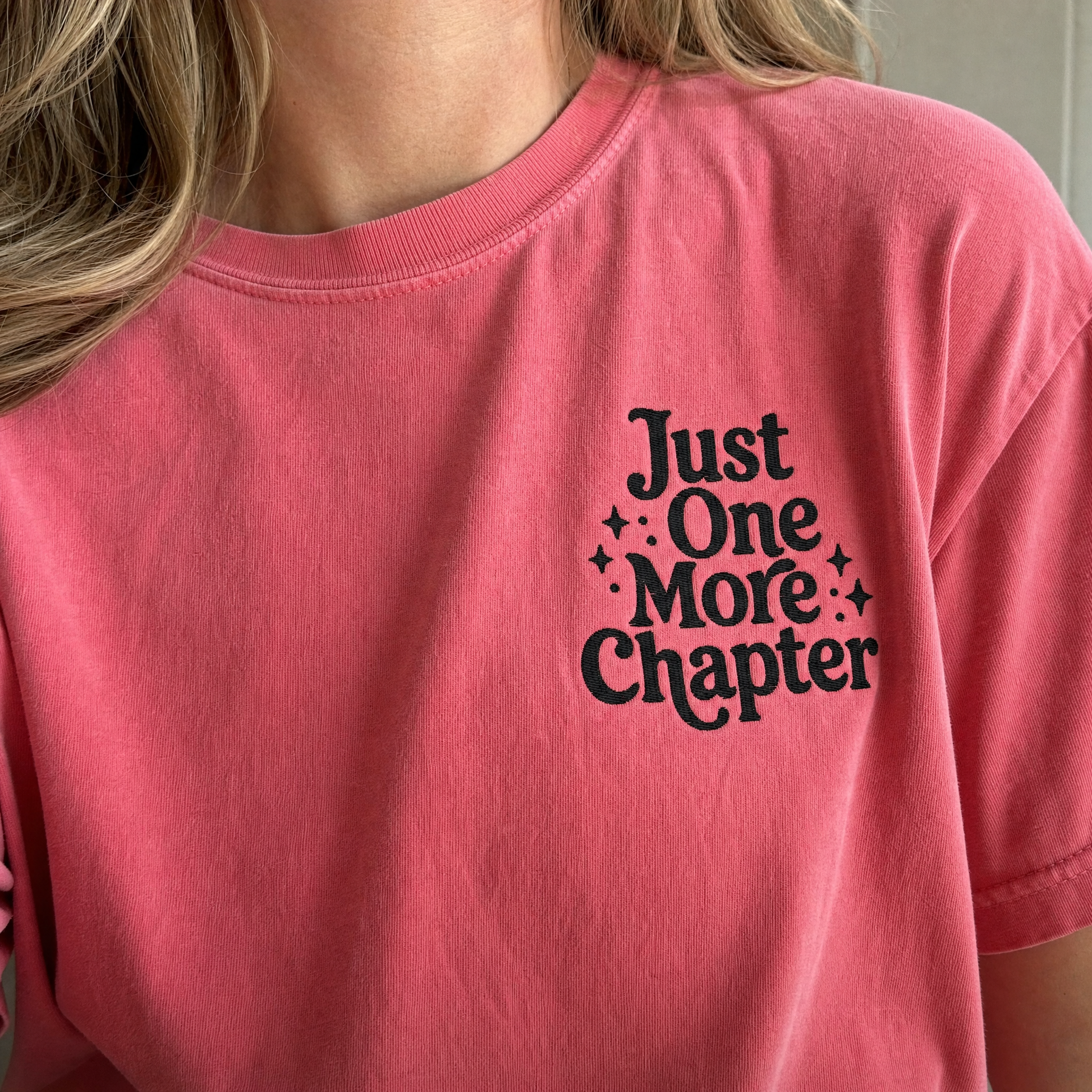 Model wearing the Just One More Chapter comfort colors tee in Crunchberry, lifestyle image 2