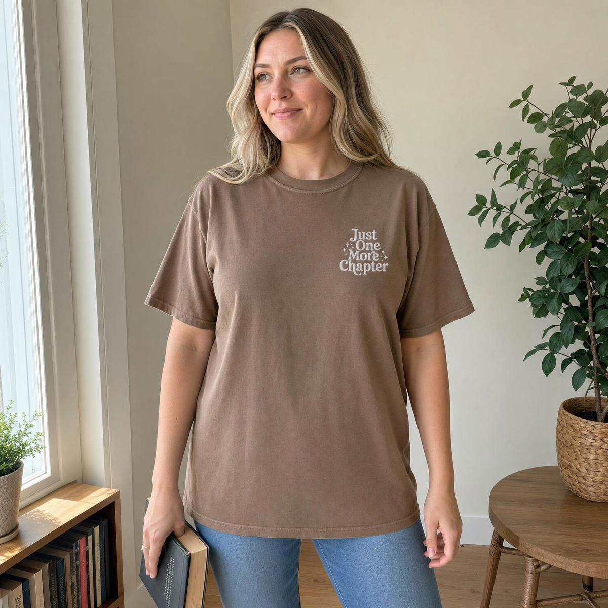 Model wearing the Just One More Chapter comfort colors tee in Espresso, lifestyle image 1