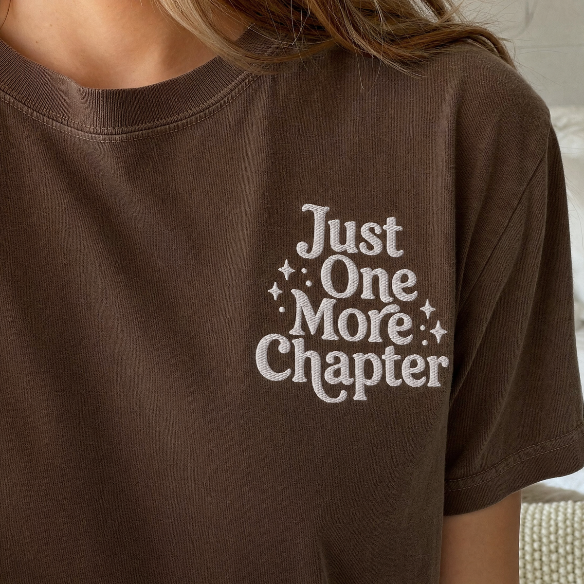 Model wearing the Just One More Chapter comfort colors tee in Espresso, lifestyle image 2