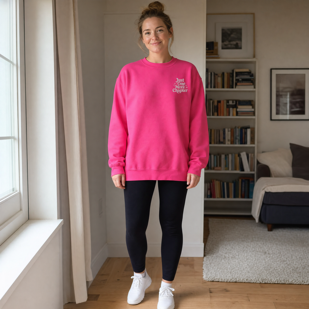 Model wearing the Just One More Chapter sweatshirt in Heliconia, lifestyle image 1