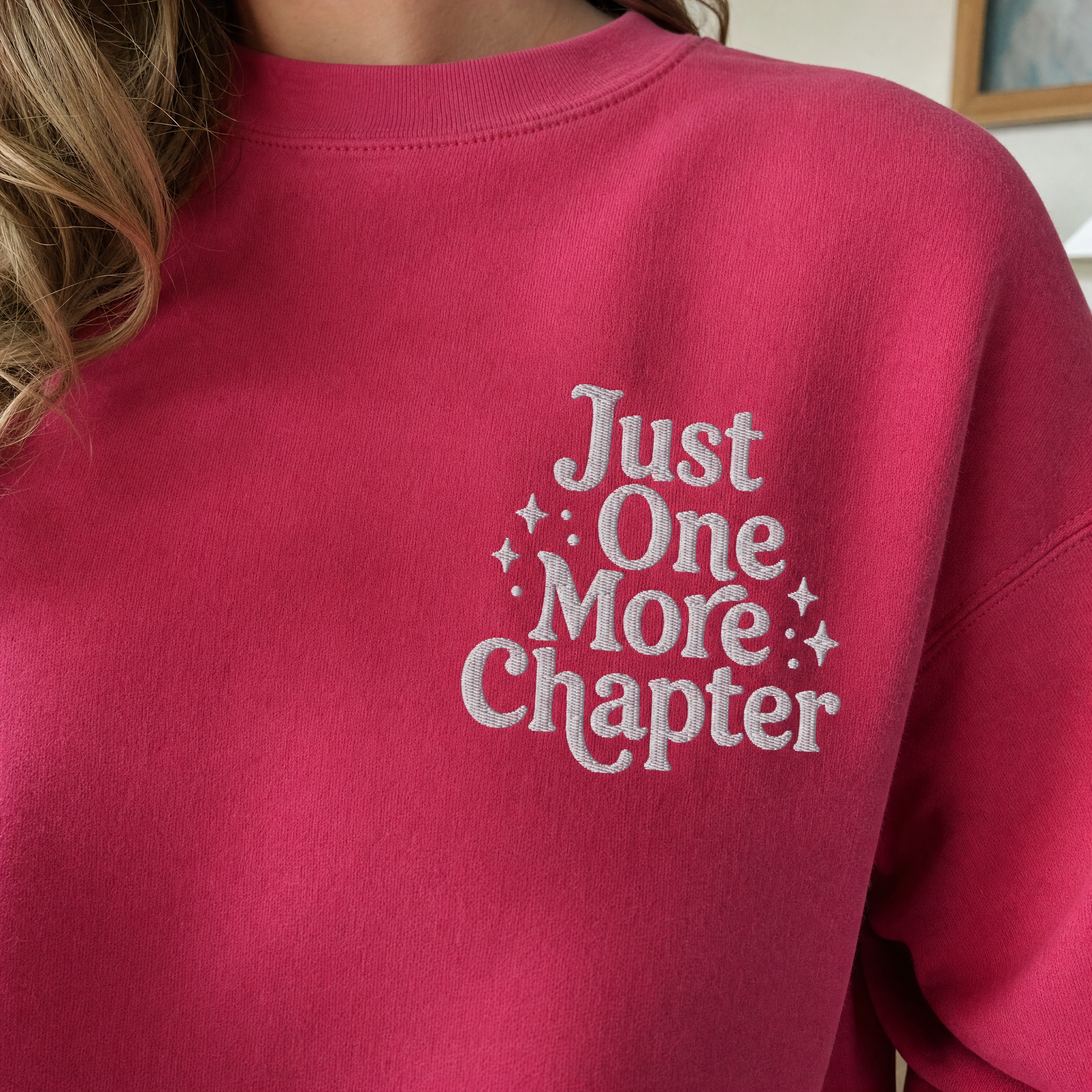 Model wearing the Just One More Chapter sweatshirt in Heliconia, lifestyle image 2