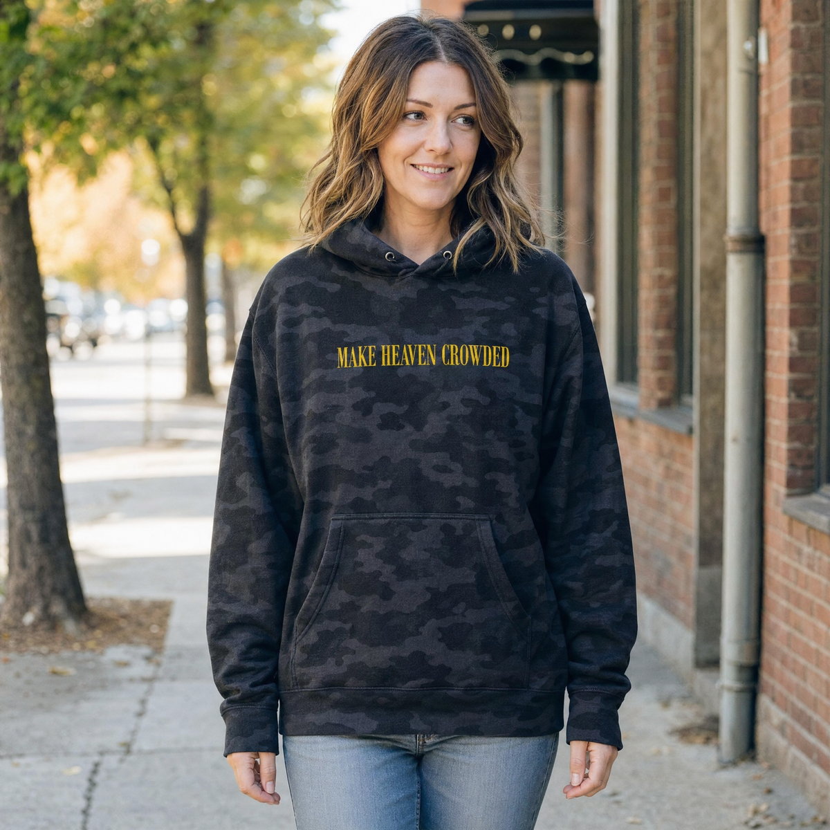 Model wearing the Make Heaven Crowded heavyweight hoodie in Black Camo, lifestyle image 1