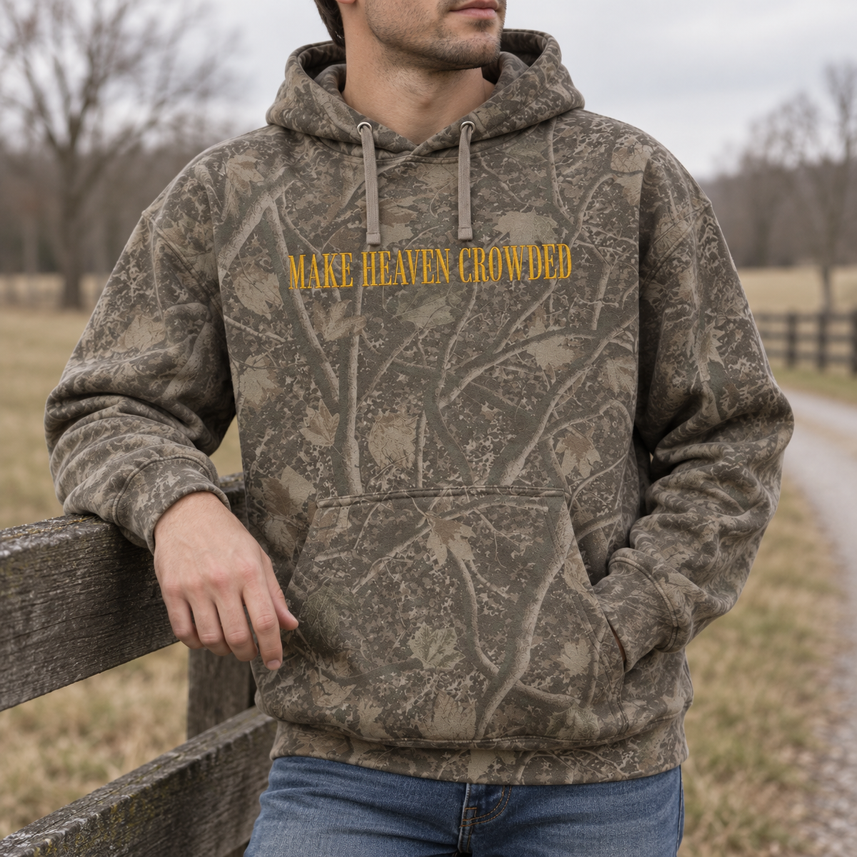 Model wearing the Make Heaven Crowded heavyweight hoodie in Light Tree Camo, lifestyle image 2