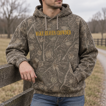 Model wearing the Make Heaven Crowded heavyweight hoodie in Light Tree Camo, lifestyle image 2