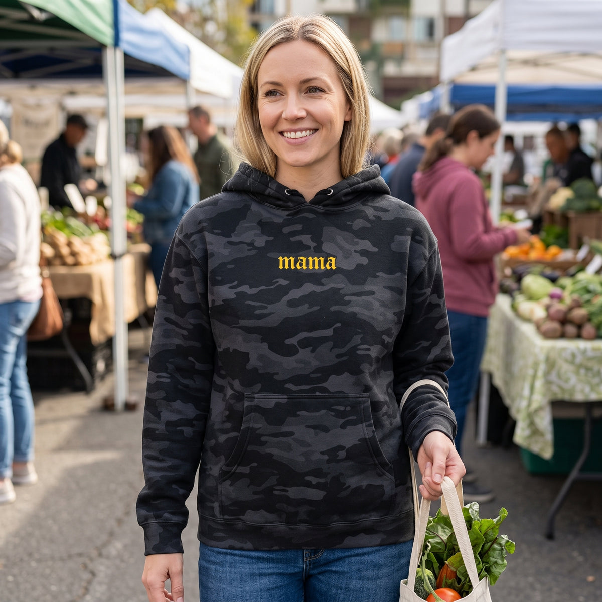 Model wearing the Mama heavyweight hoodie in Black Camo, cover image 1