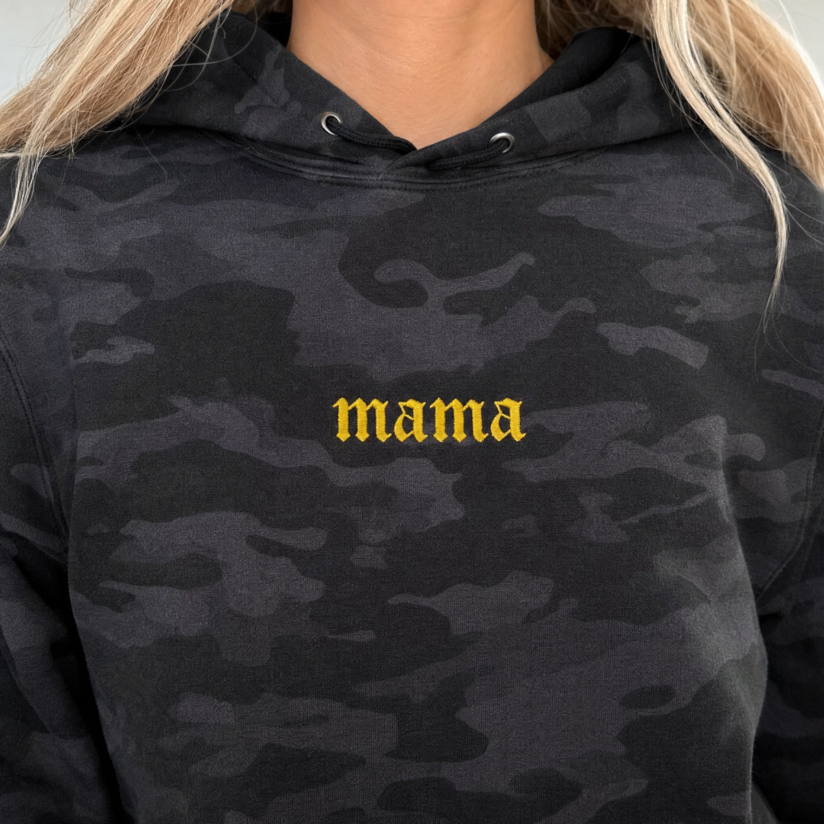 Model wearing the Mama heavyweight hoodie in Black Camo, lifestyle image 1